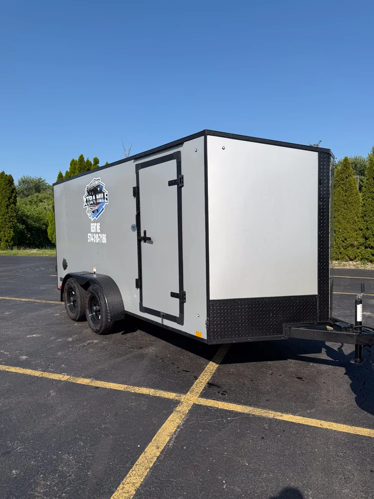 Xtra Mile enclosed cargo trailer with side access door.