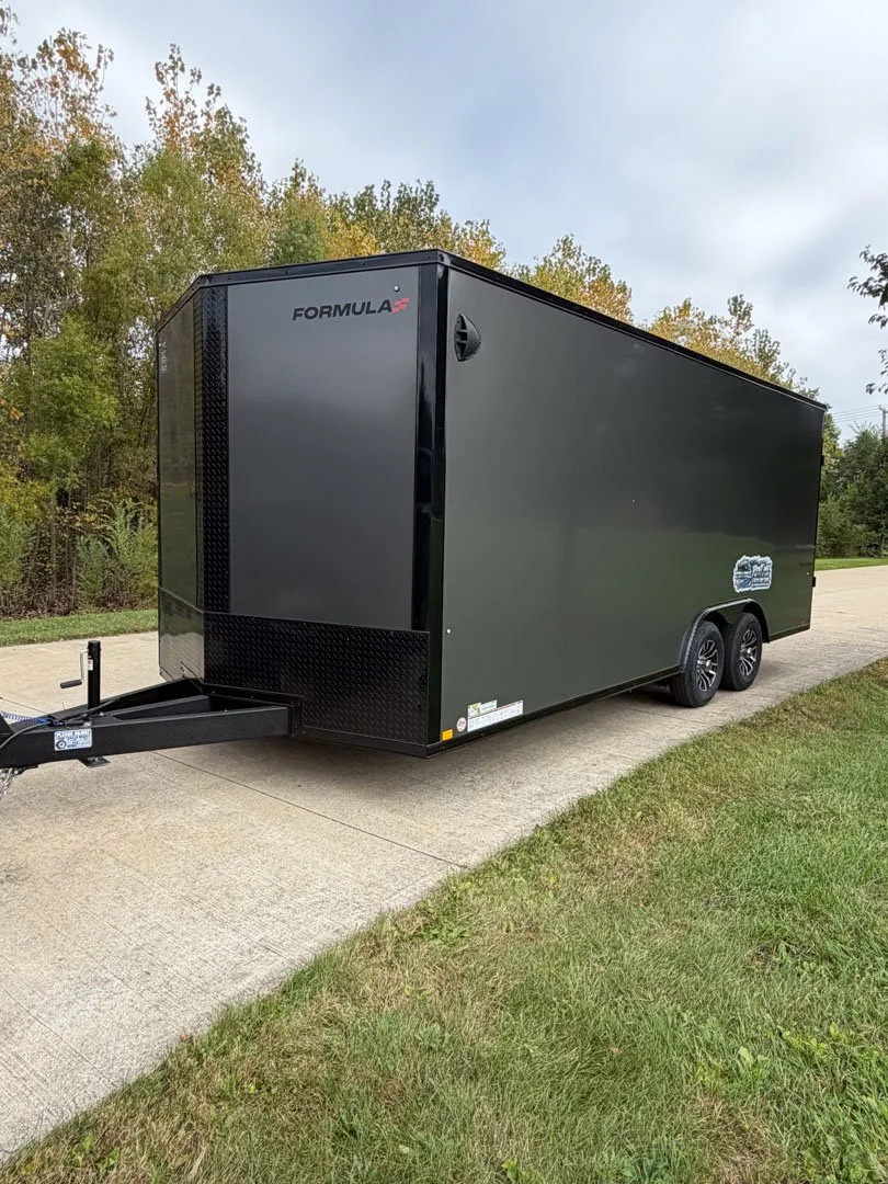 enclosed trailer sitting on driveway