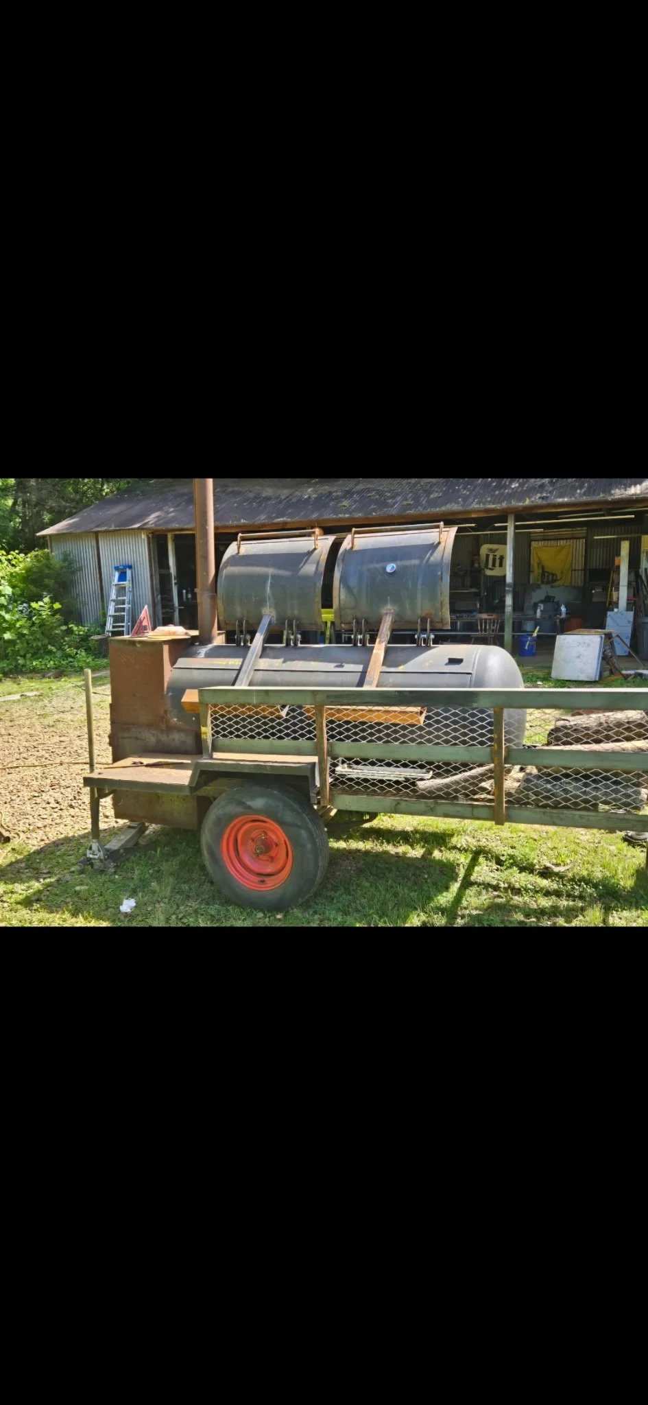 Custom dual-barrel offset smoker mounted on a mobile trailer chassis. Built with thick-gauge steel for perfect heat retention and competition-grade BBQ.