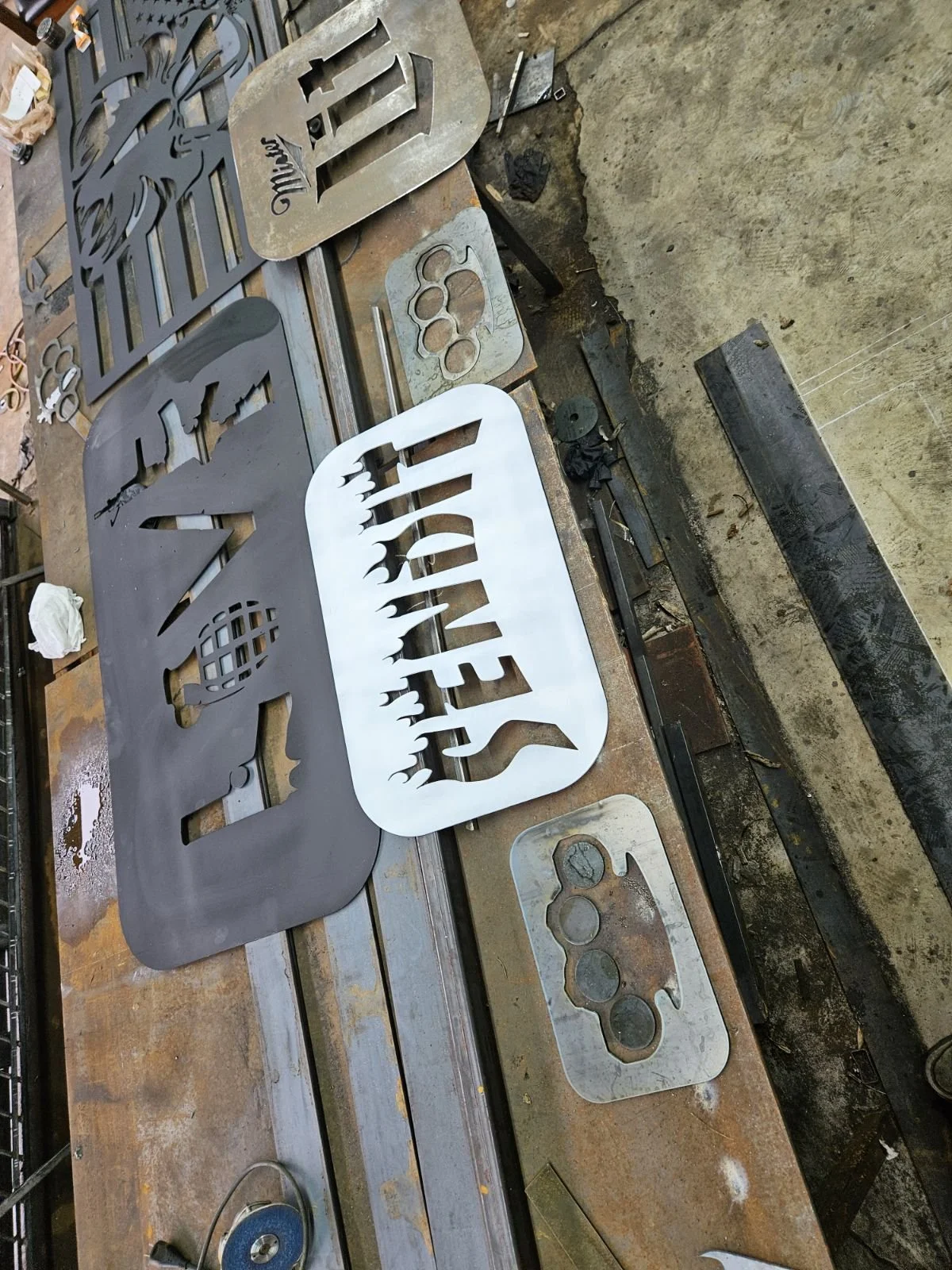 Custom CNC plasma-cut "SEND IT" steel sign. Heavy-duty industrial design featuring precision-cut bold typography, perfect for a personalized shop sign, garage decor, or a rugged gift.