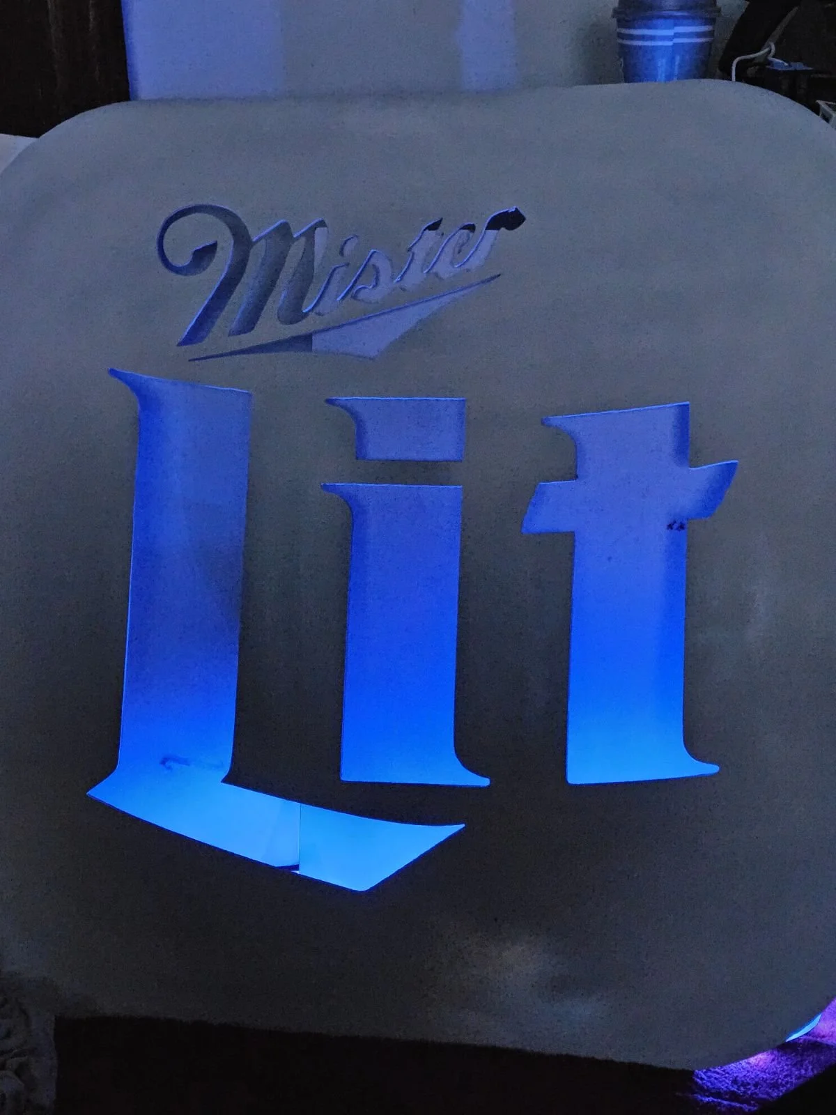 Custom backlit steel bar sign. Features a precision CNC plasma-cut "Mister Lit" design with custom integrated blue LED backlighting, perfect for personalized home bars, game rooms, or commercial pub decor.