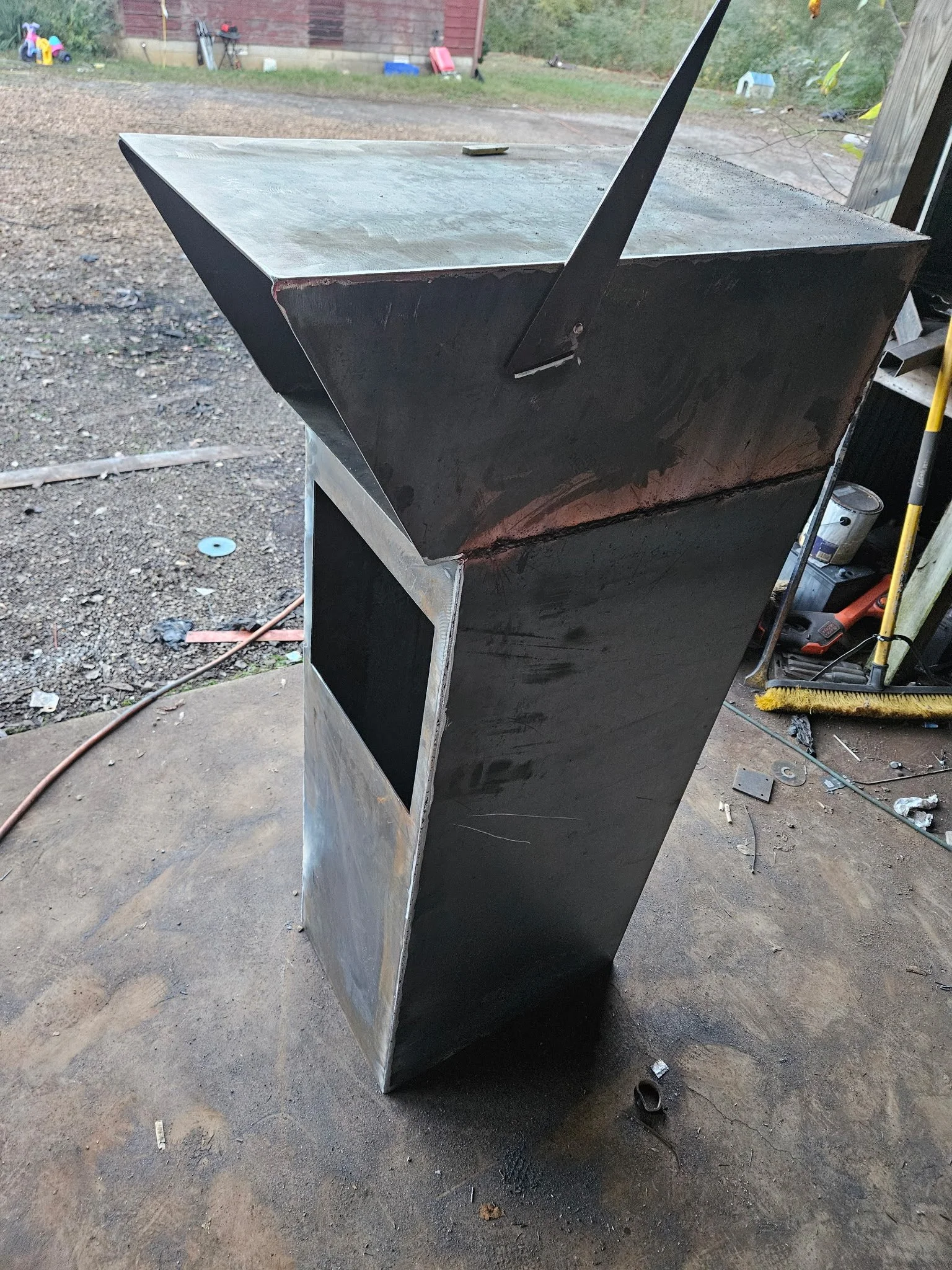Heavy-gauge structural steel fabrication of our custom architectural mailbox post, shown mid-process before receiving its durable powder-coated finish and custom CNC-cut house numbers. Built robust from thick steel to provide maximum durability and m