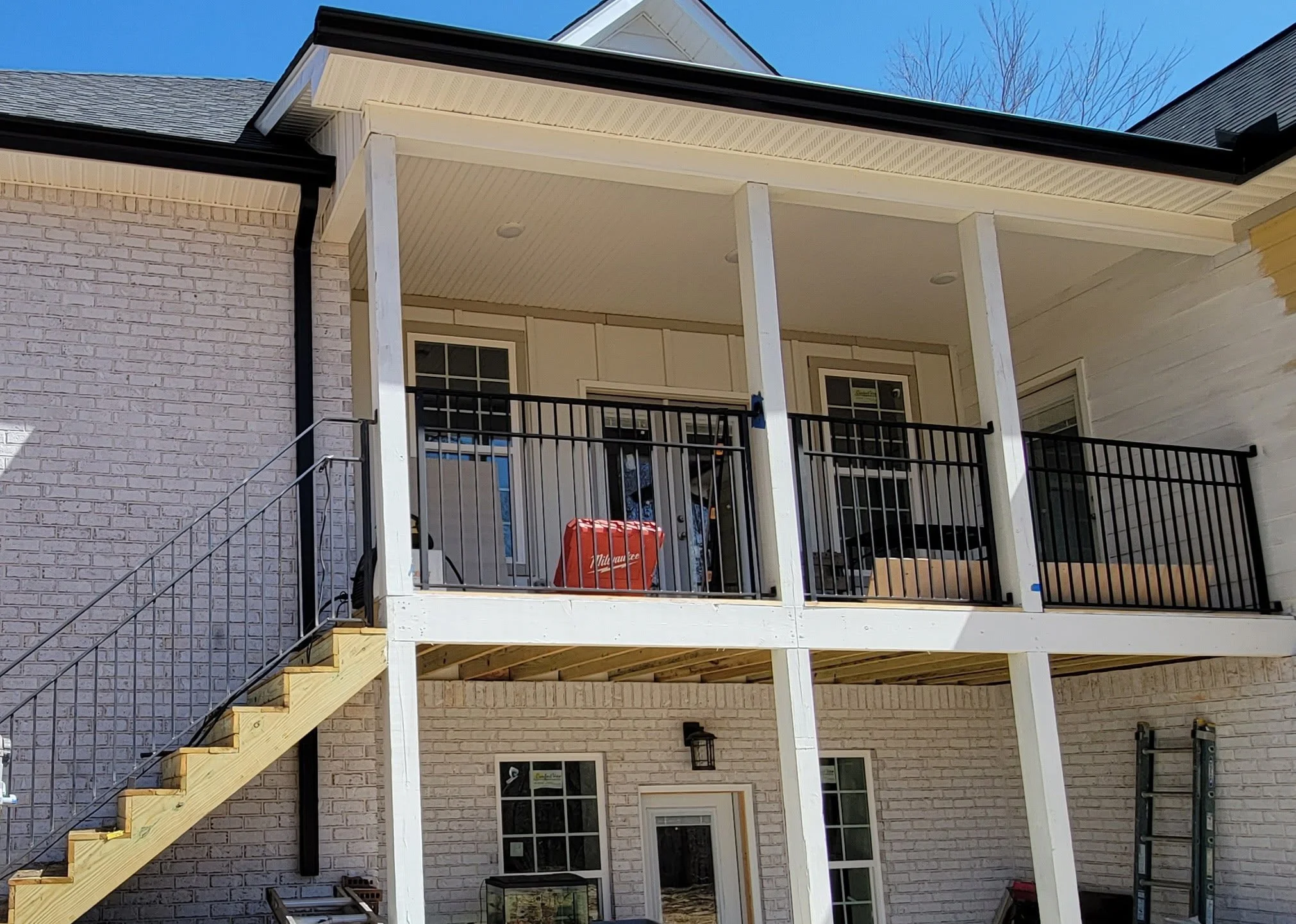 Custom multi-level exterior residential steel balcony railing and matching outdoor staircase system. Built with premium structural steel and finished with a weather-resistant coating for long-lasting durability and safety.