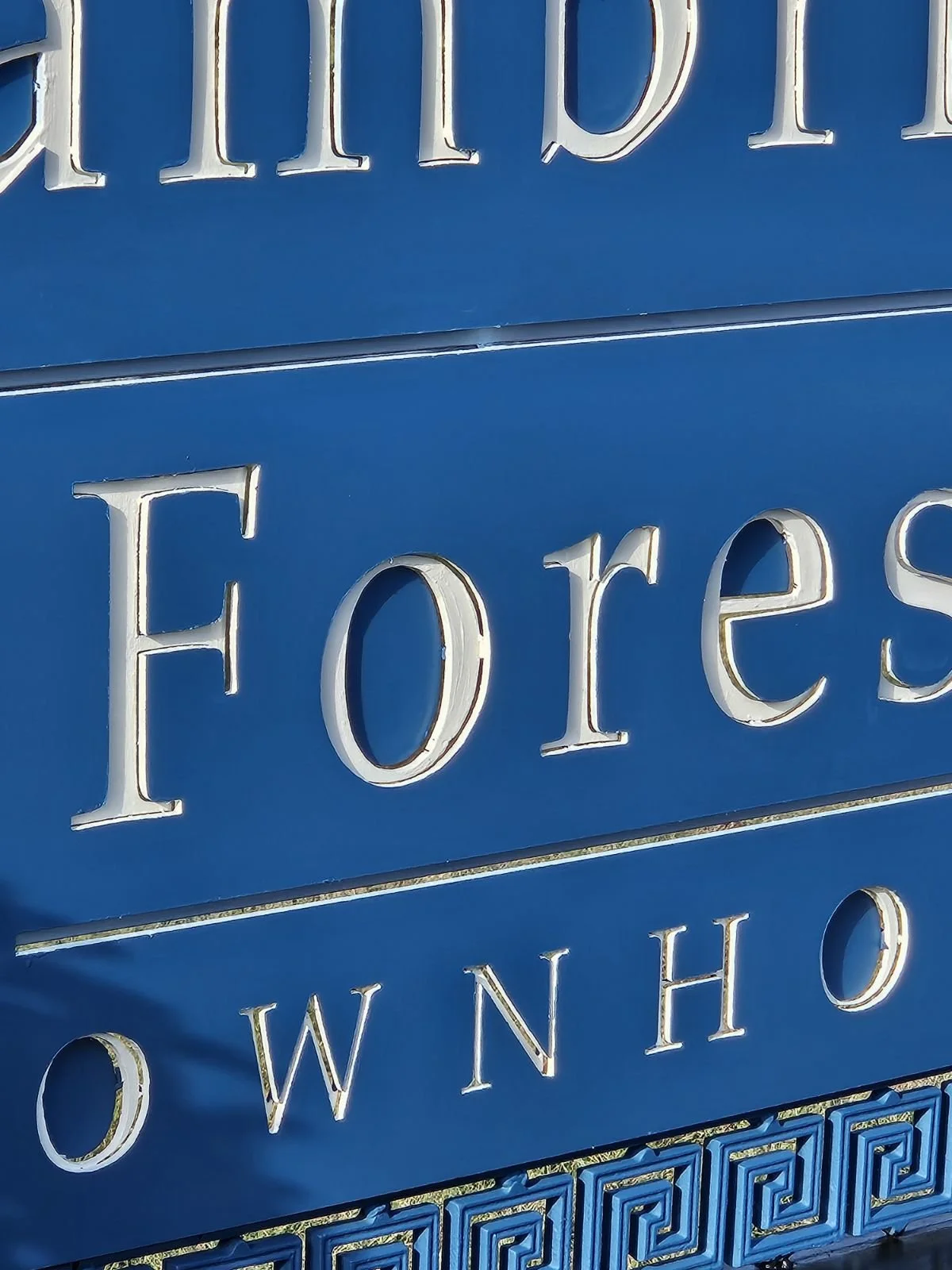 Custom multi-layered CNC plasma-cut steel property sign. Features a vibrant blue finish with precision-cut dimensional lettering, designed to provide a highly visible and durable branding solution for estates or businesses.