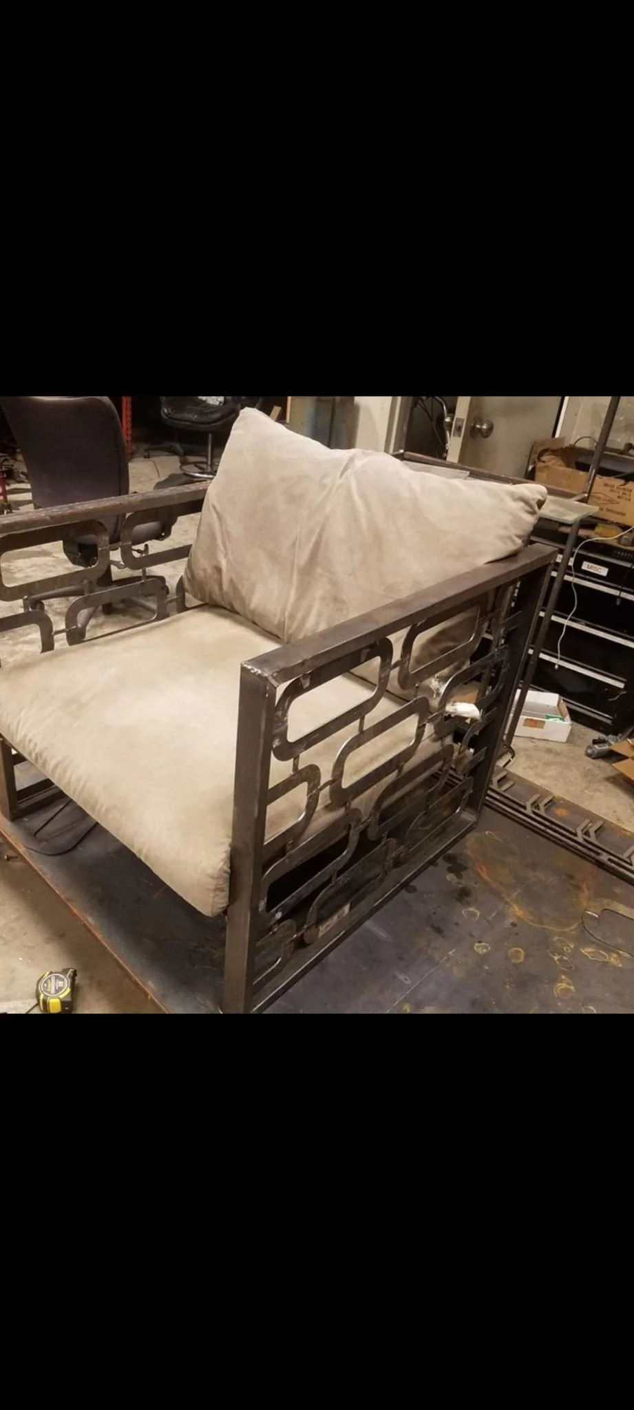 Custom geometric modern industrial lounge chair. Features a bespoke, precision-welded steel accent frame paired with premium, deep-seated cushions to deliver exceptional comfort and high-end architectural style.