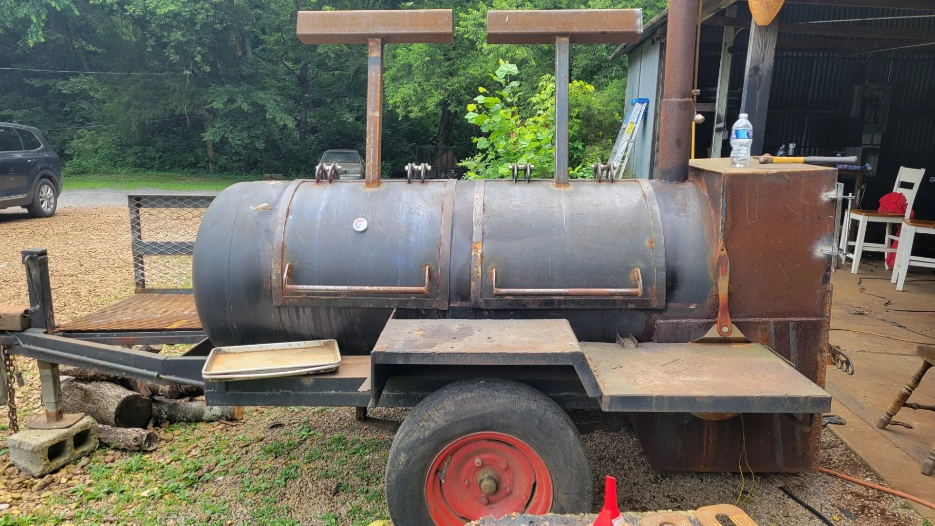 Heavy-duty custom horizontal offset smoker. Precision-welded airtight seals and custom temp-gauge placements for ultimate airflow control.