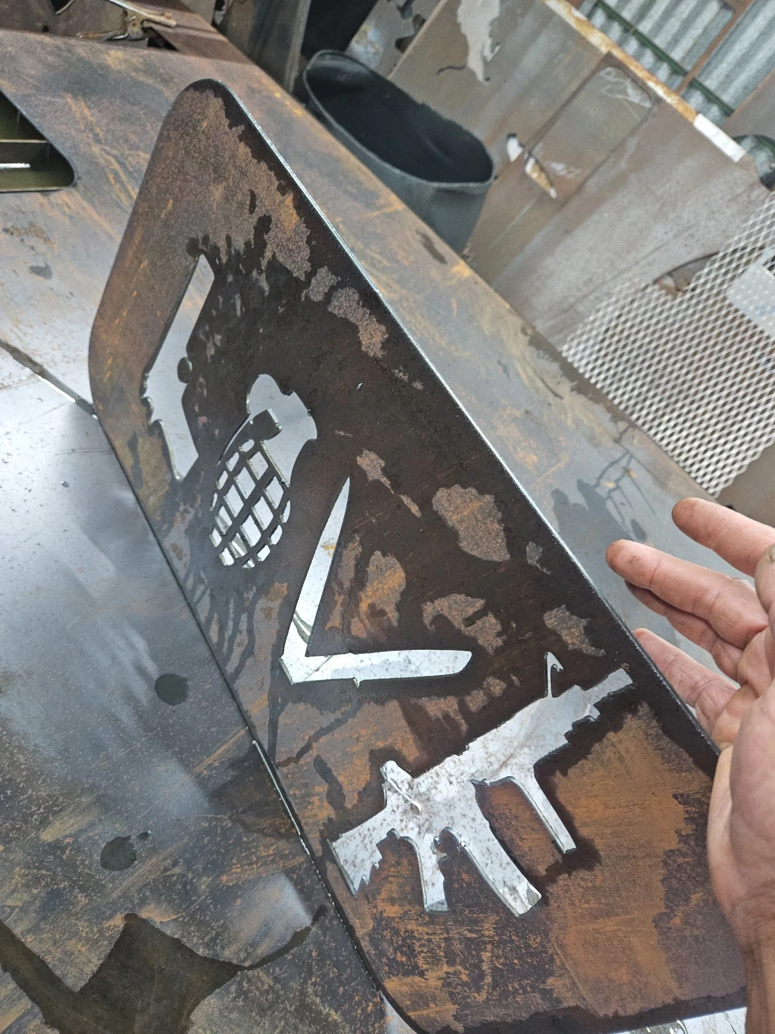 Custom CNC plasma-cut tactical steel sign. Features a rugged, raw-metal finish with a precision-cut "LOVE" lettering design and integrated rifle graphic, perfect for custom garage art, man caves, or industrial decor.