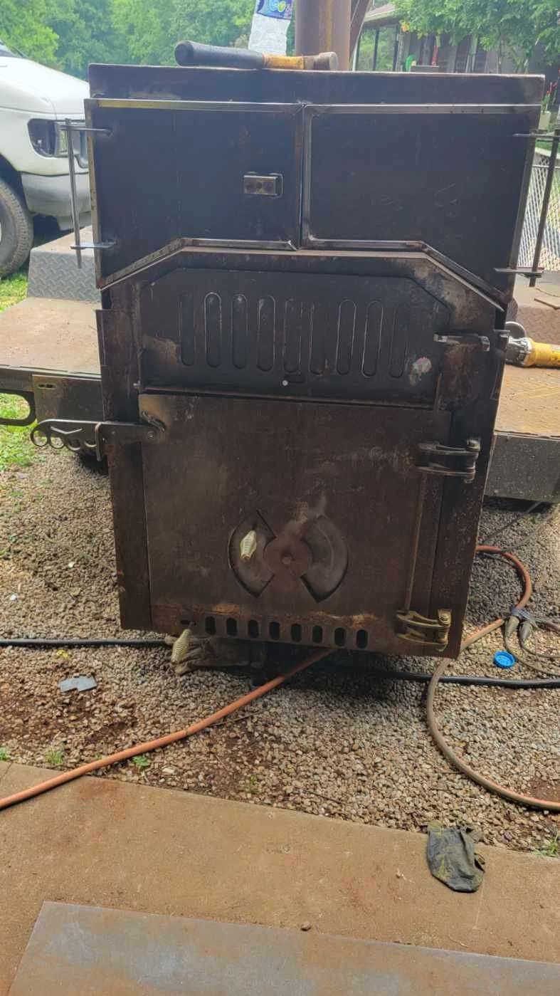Reverse-flow smoker design detailing custom intake vents and heavy-duty structural steel framing built to outlast a lifetime.