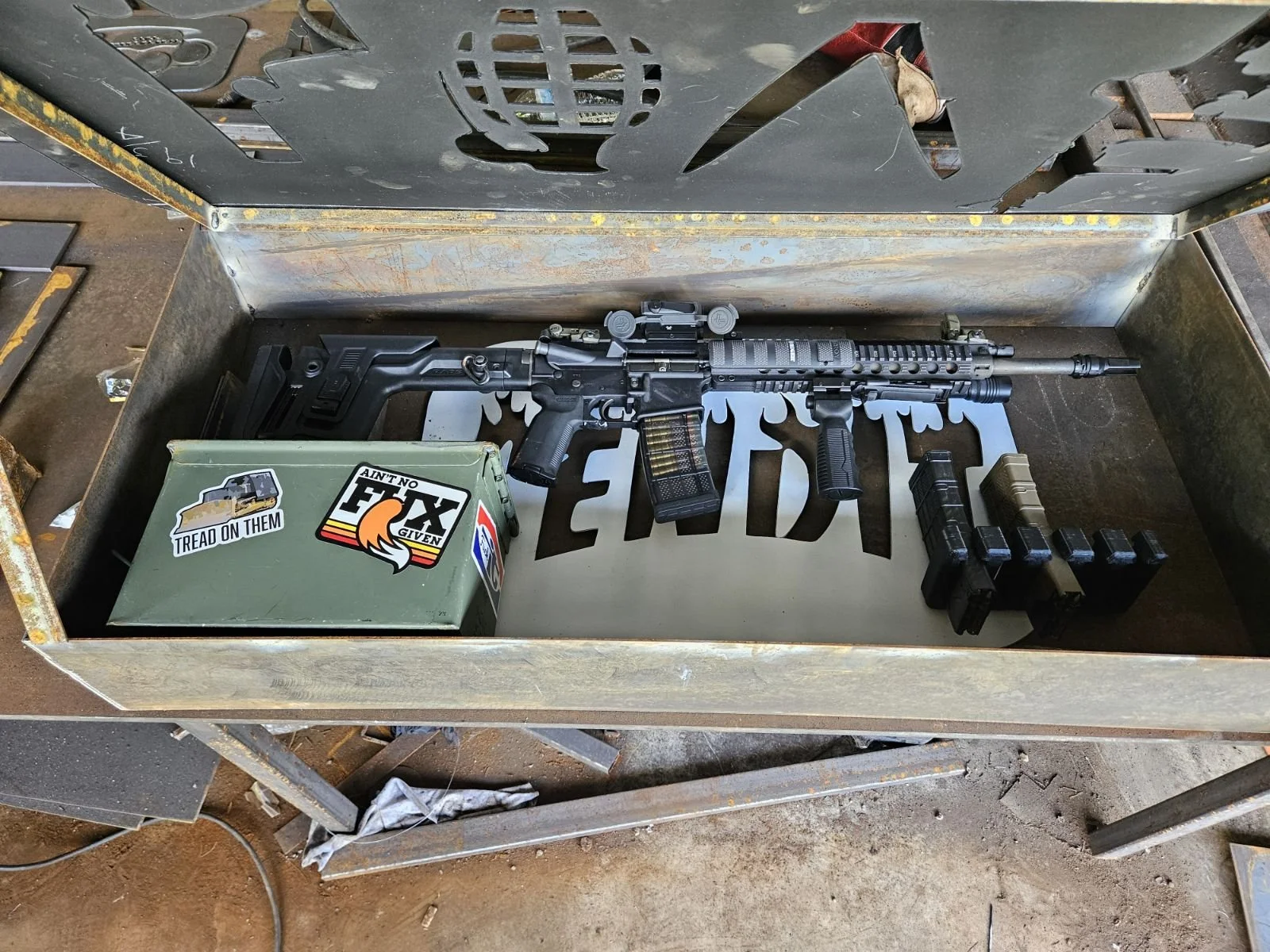 Custom heavy-duty tactical metal storage case. Precision-fabricated from durable steel, featuring a secure latch system, customized foam inserts for gear protection, and a sleek CNC-cut custom logo.
