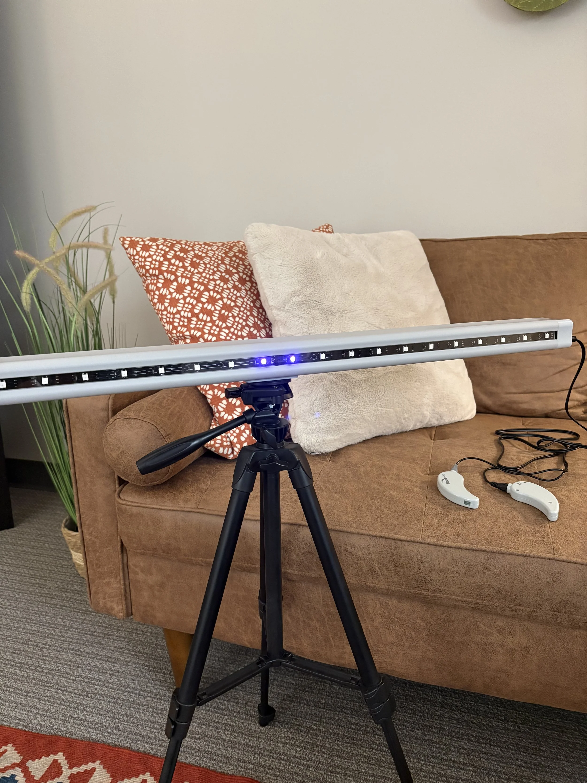 EMDR light bar next to sofa