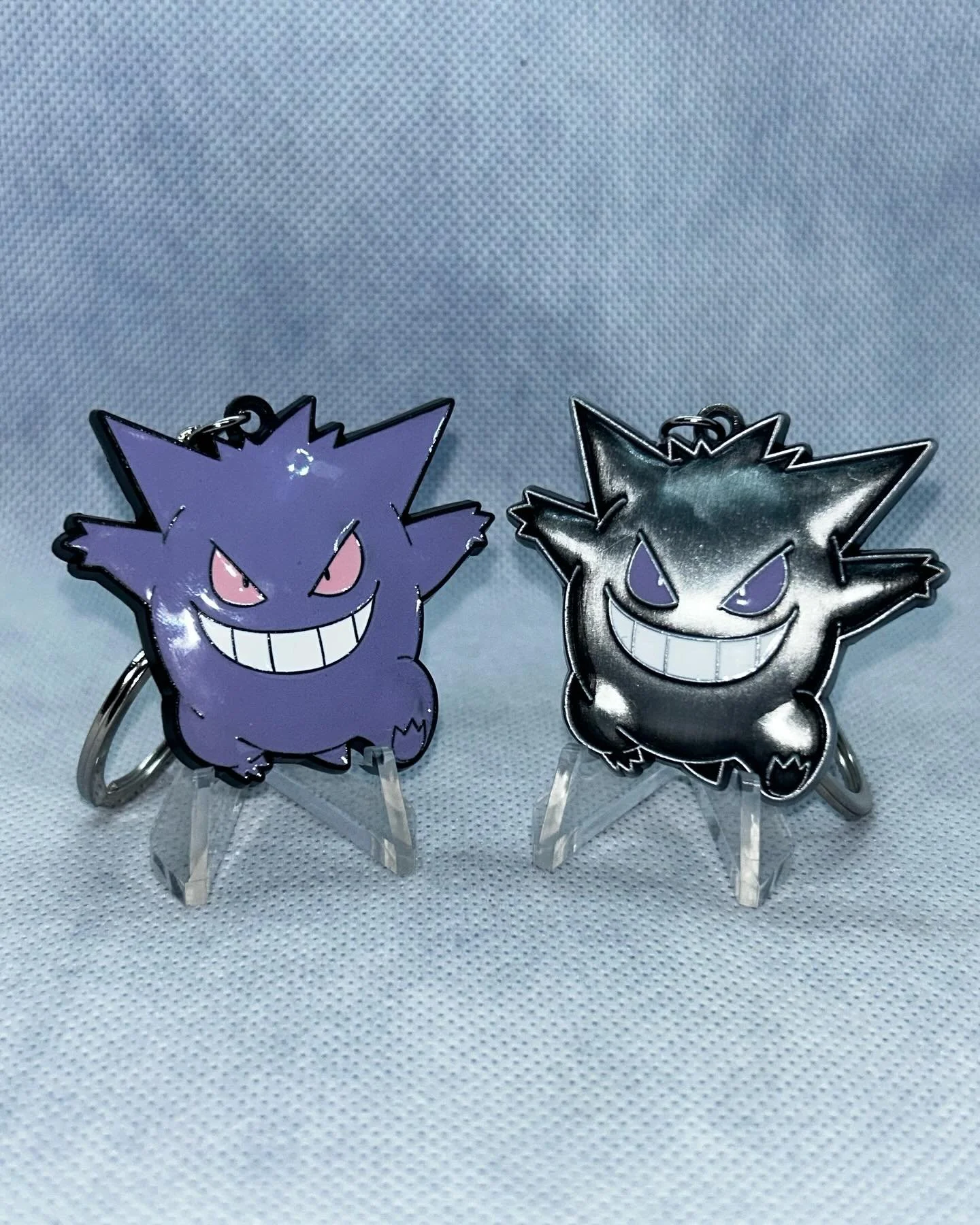 LINK IN BIO TO PURCHASE! Discounts available! 

Gengar Pok&eacute;mon Keychain 

2x2 inch 

3mm thick 

2 variations made: Purple and Antique Silver 

This product includes the debut of my new logo engraved right on the back! All of my future product