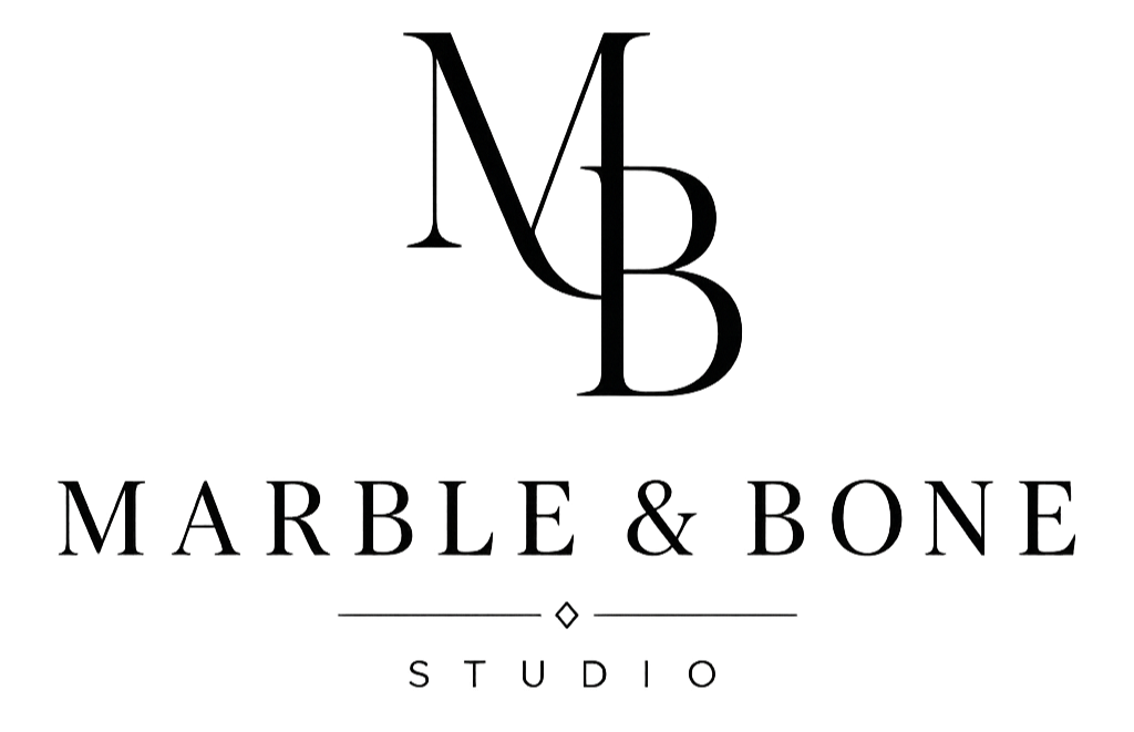 Logo of Marble & Bone Studio featuring stylized initials M and B and the studio name underneath.