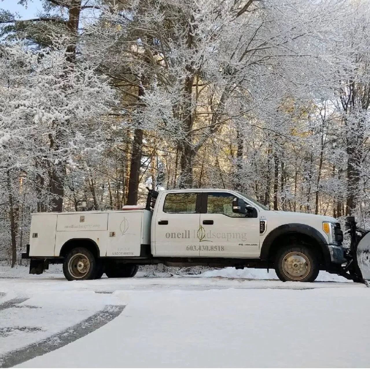 Commercial snow removal truck servicing winter properties in New Hampshire and Maine