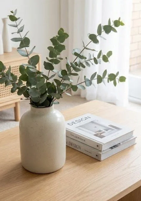 dining table with ceramic pot and decorative books