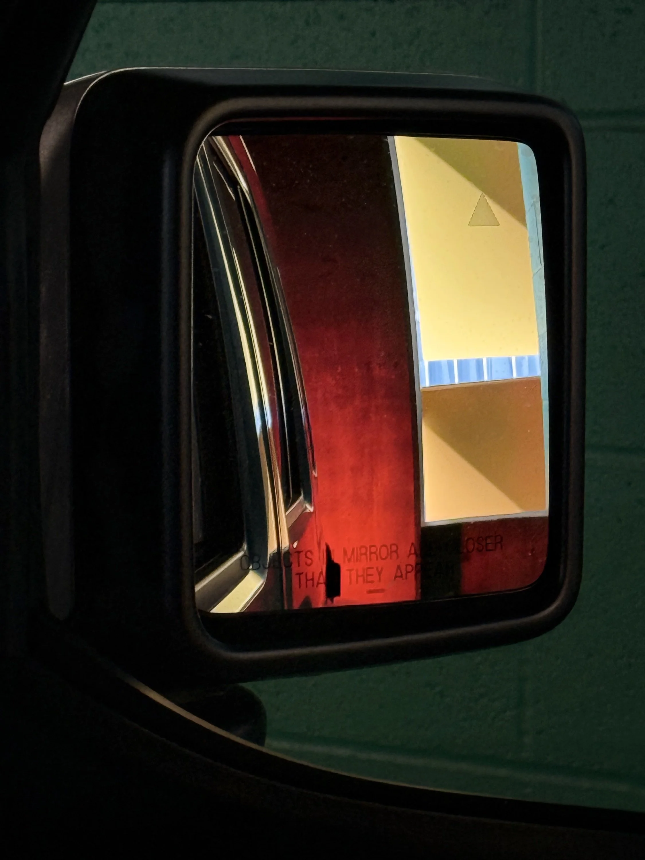Side view mirror in parking garage - Portland, Oregon