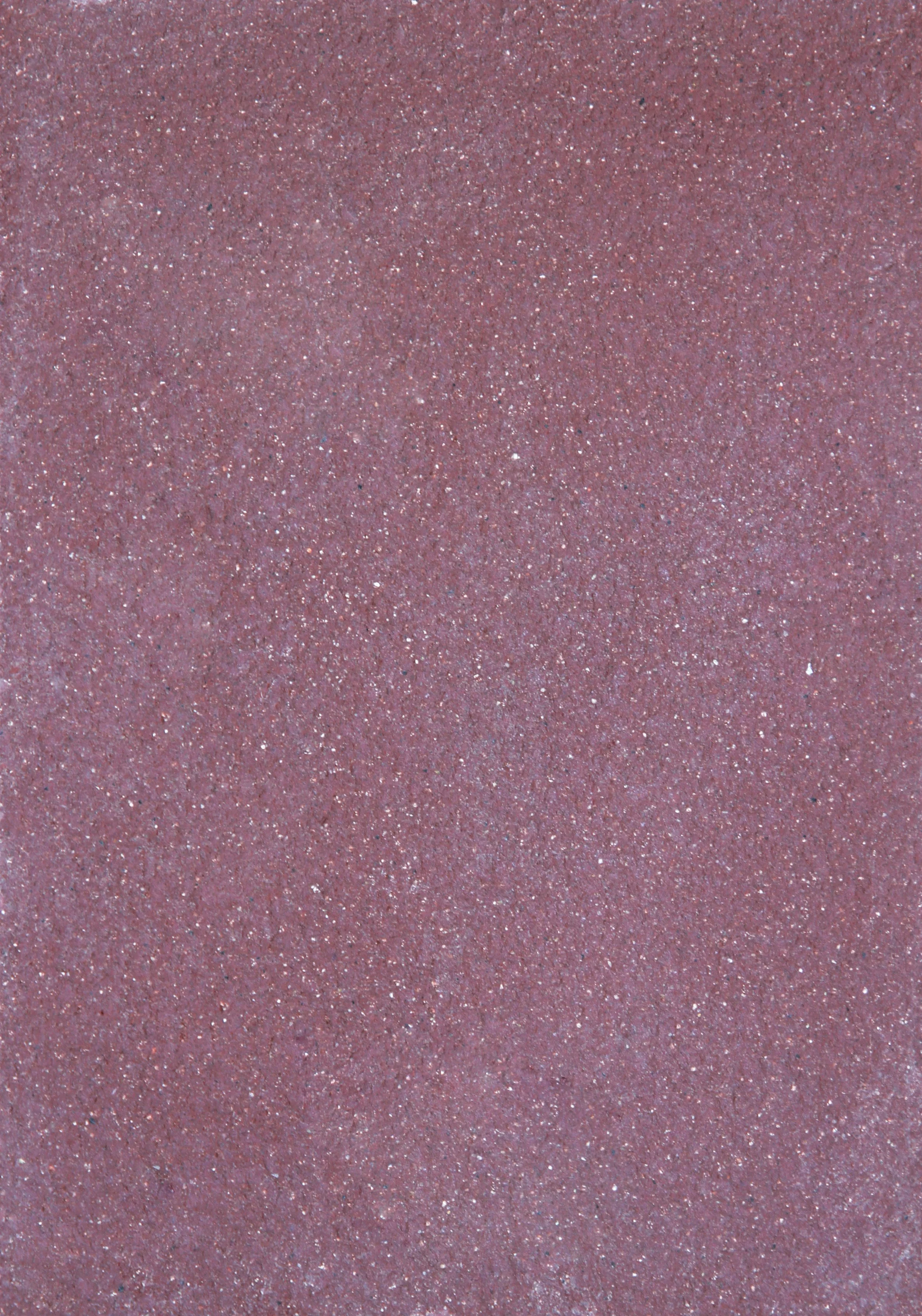 Close-up of a pink glittery textured surface.