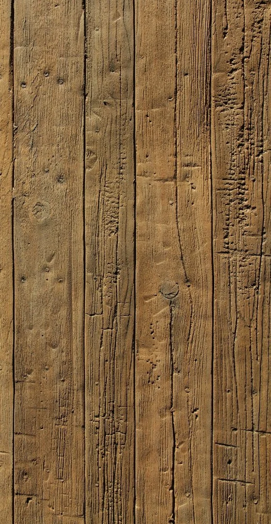 Close-up of a wooden surface with visible grain, knots, and cracks.