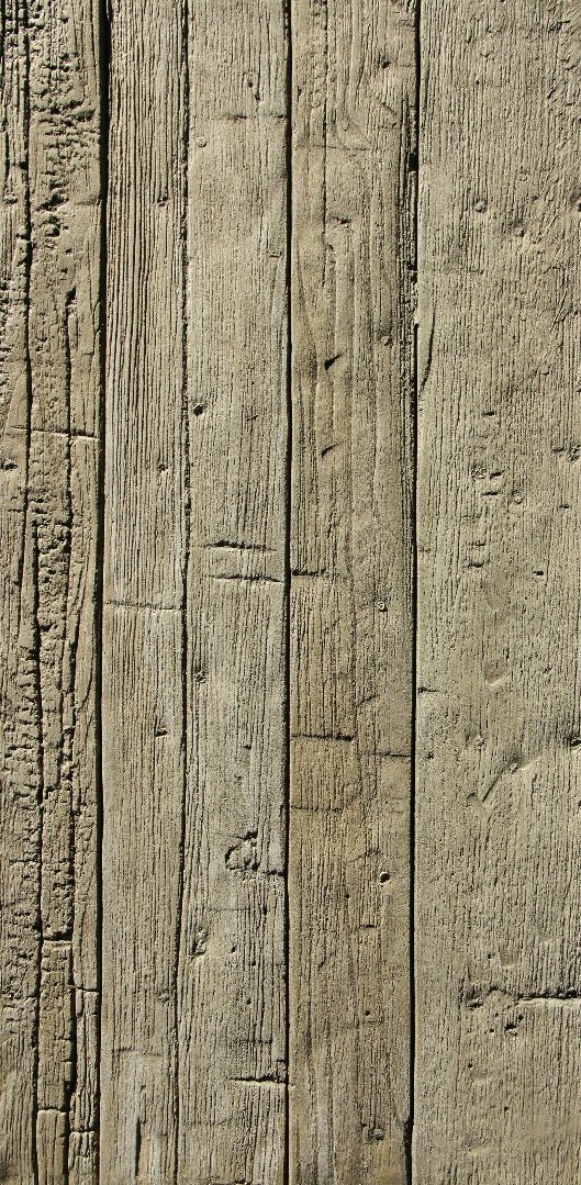 Close-up of weathered wooden planks with visible grain and knots.
