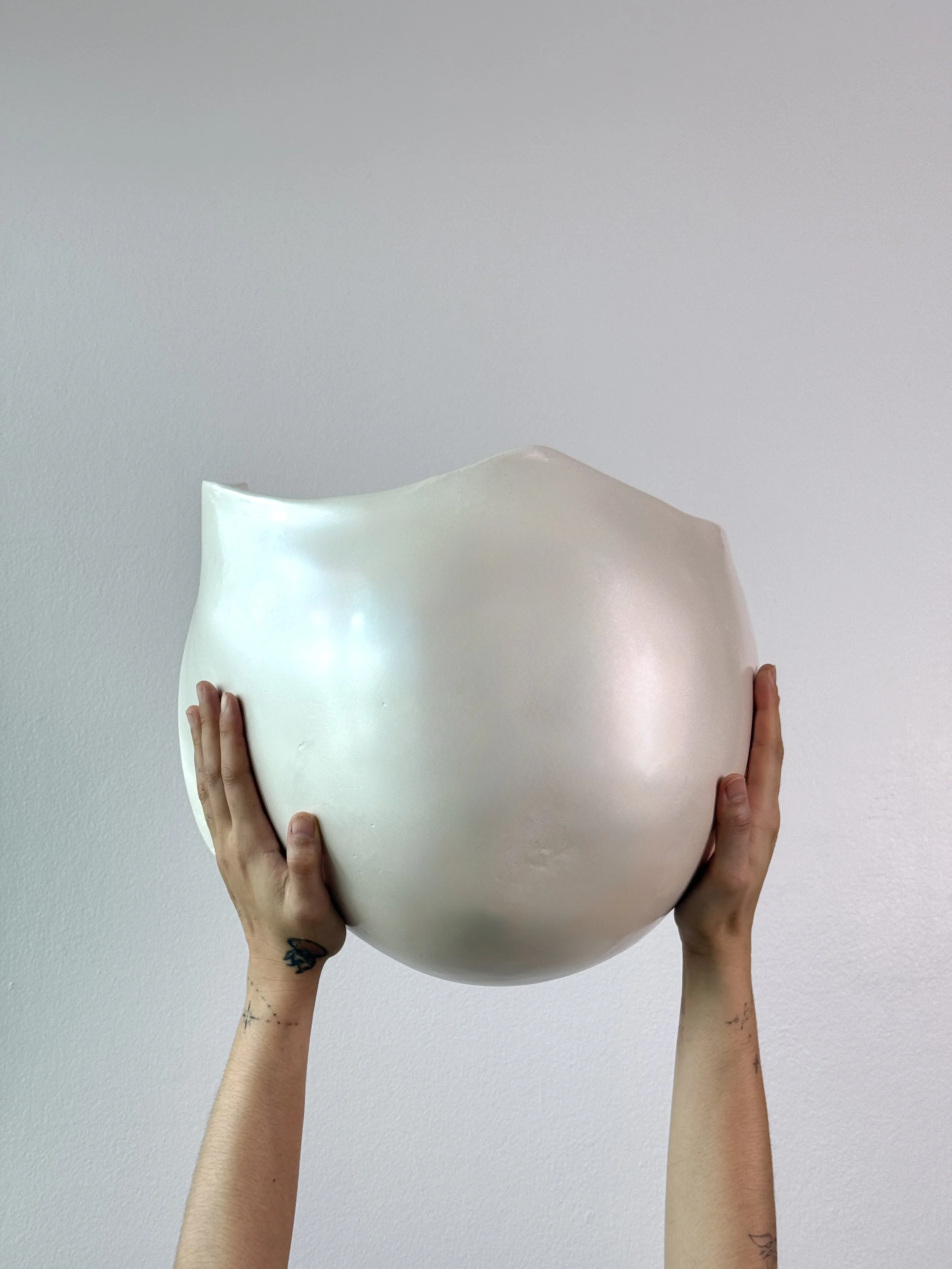 holding-pearly-white-pregnant-belly-casting.jpg