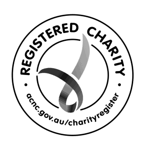 Close-up of a curl of gray thread or yarn on a black background.