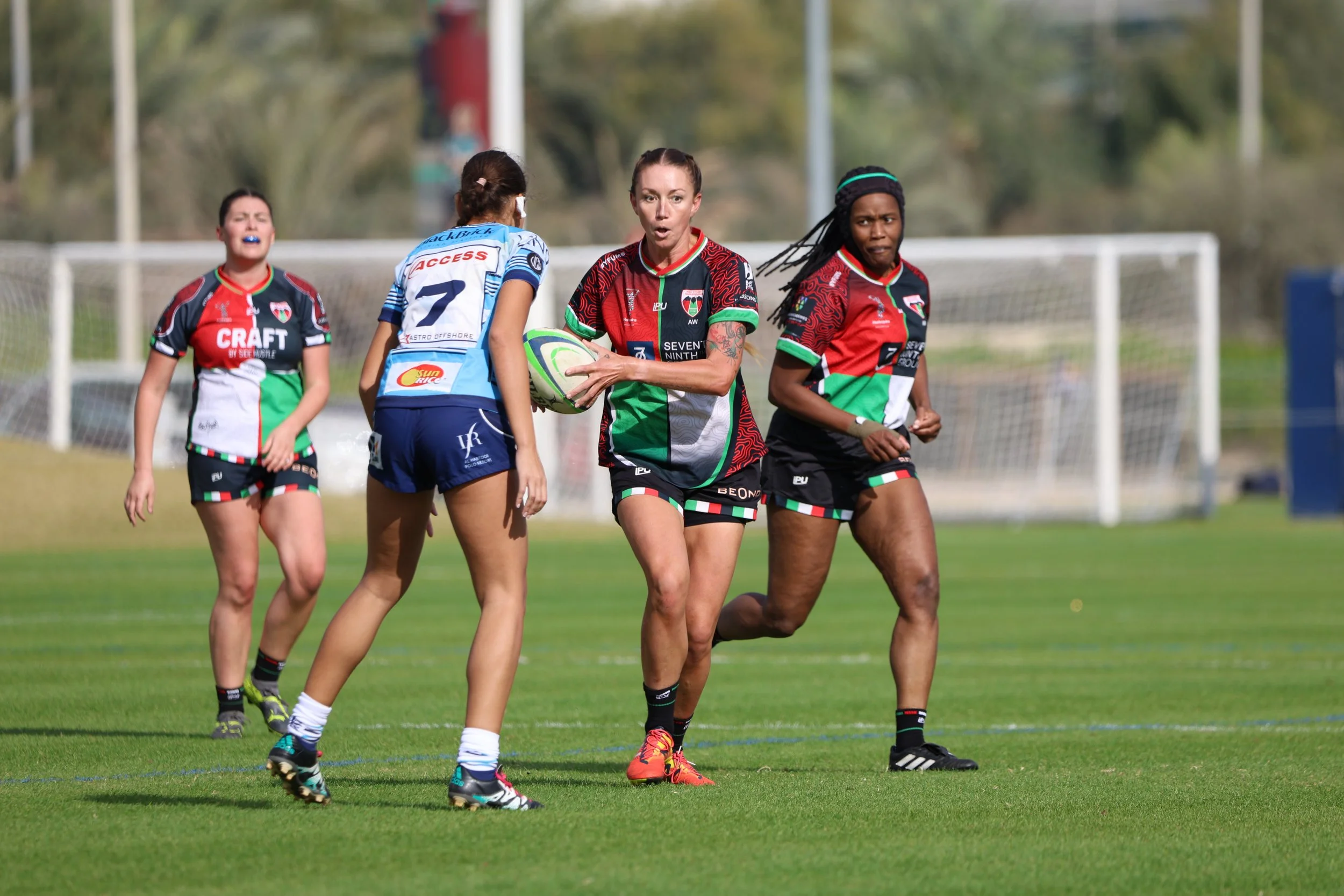 TJ Manson carrying the ball during a women's rugby match
