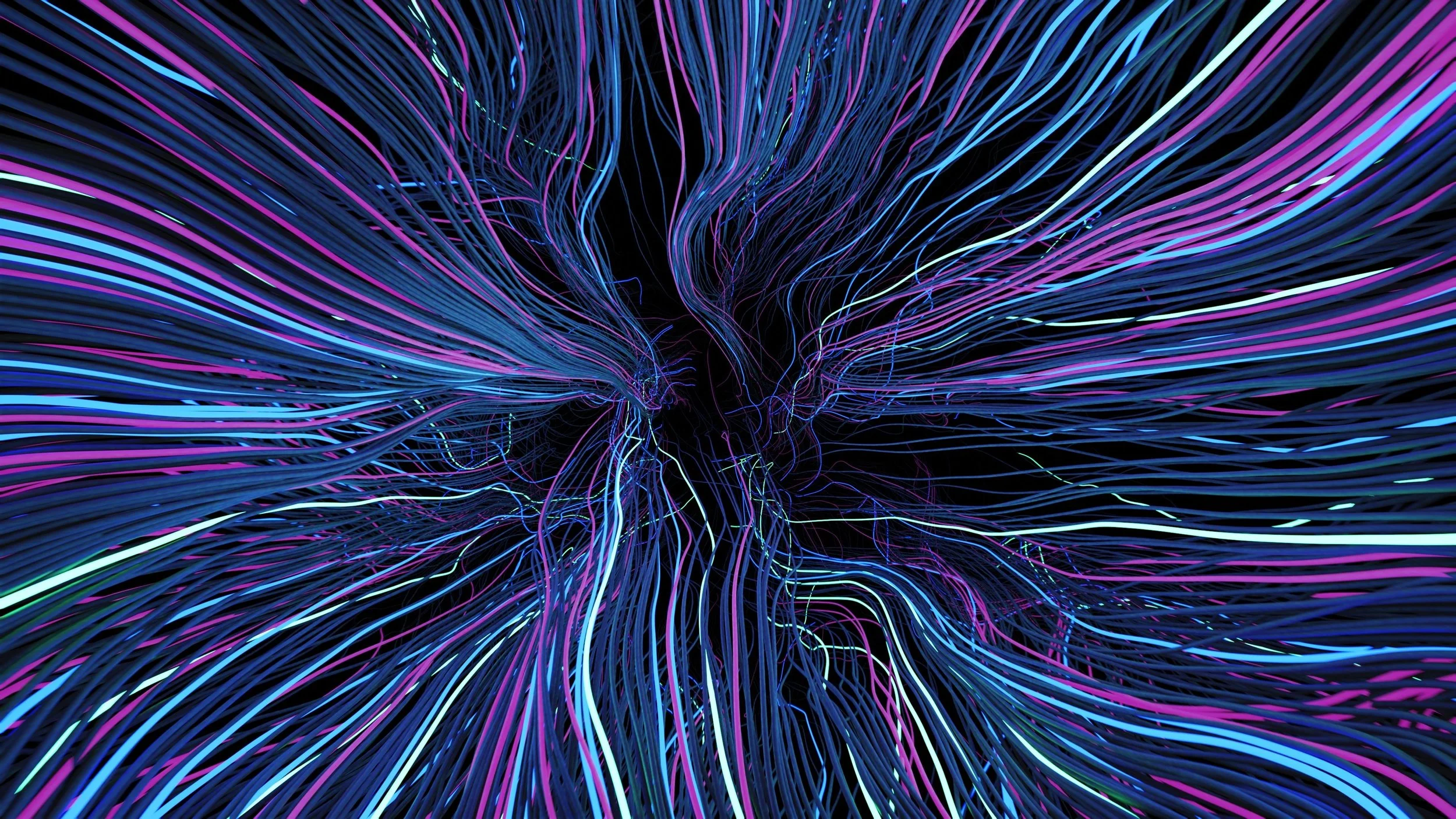 A digital artwork depicting colorful, glowing lines and streaks flowing outward on a black background, creating an abstract, dynamic effect.