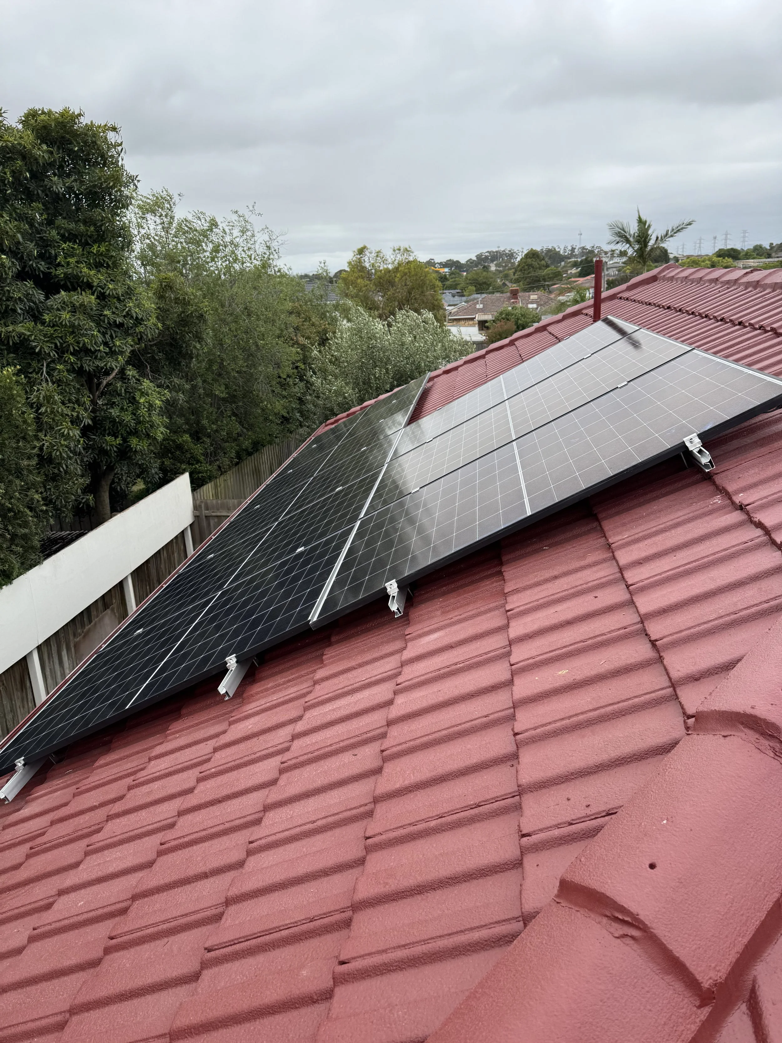 Oranssi technician working on a roof project