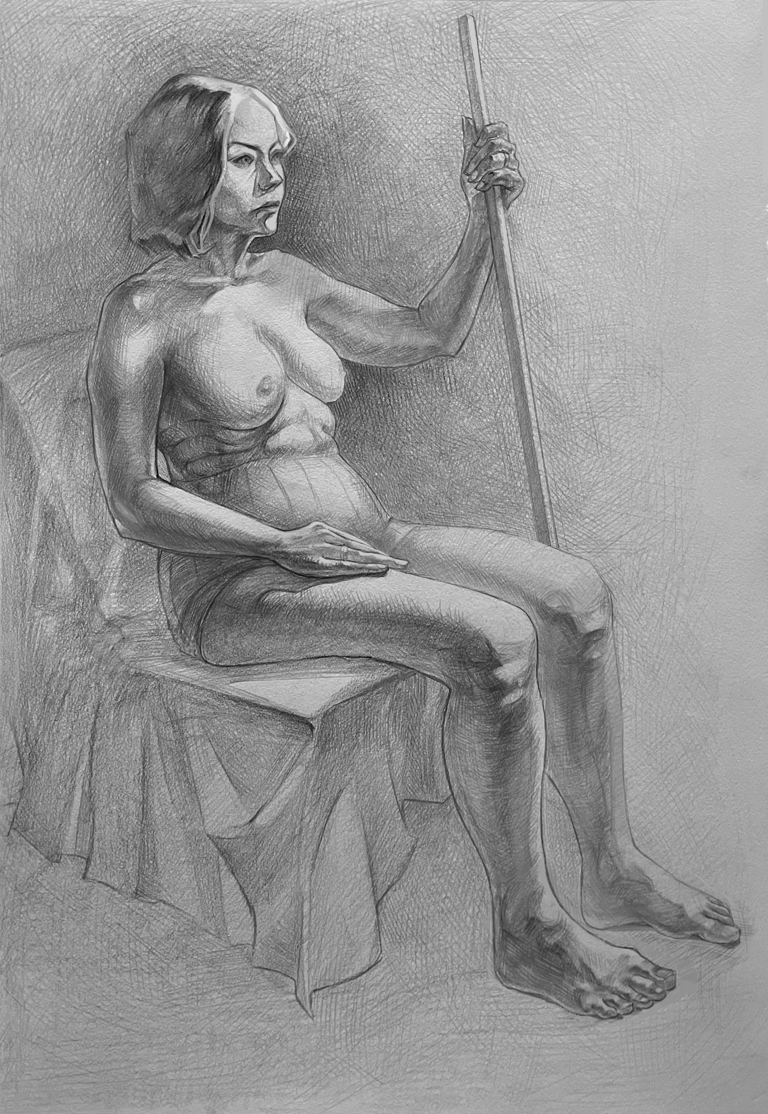 A pencil drawing of a nude woman sitting on a chair, holding a long stick or staff, with her legs crossed and head slightly turned to the side.