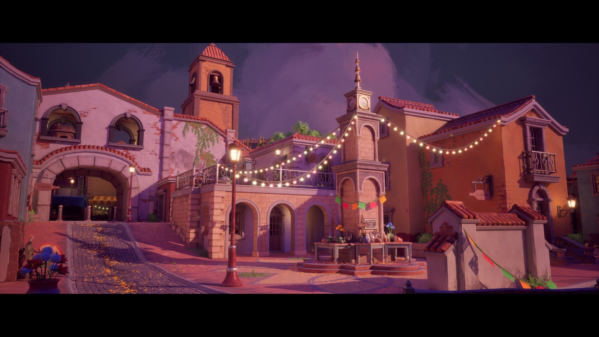 Colorful European-style village square at dusk with string lights, clock tower, and decorative buildings with terracotta roofs.