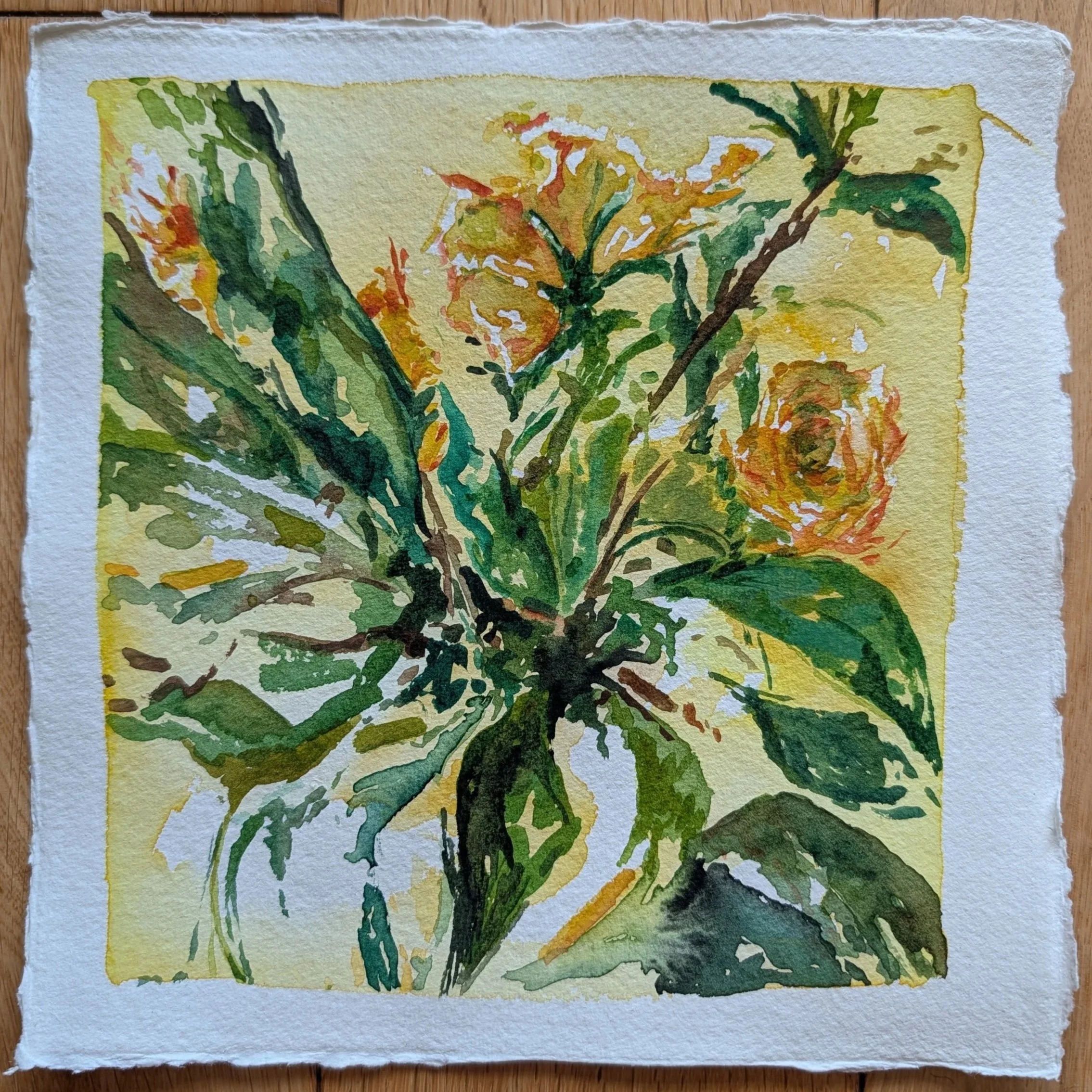 Watercolor painting of orange and yellow flowers with green leaves on textured paper