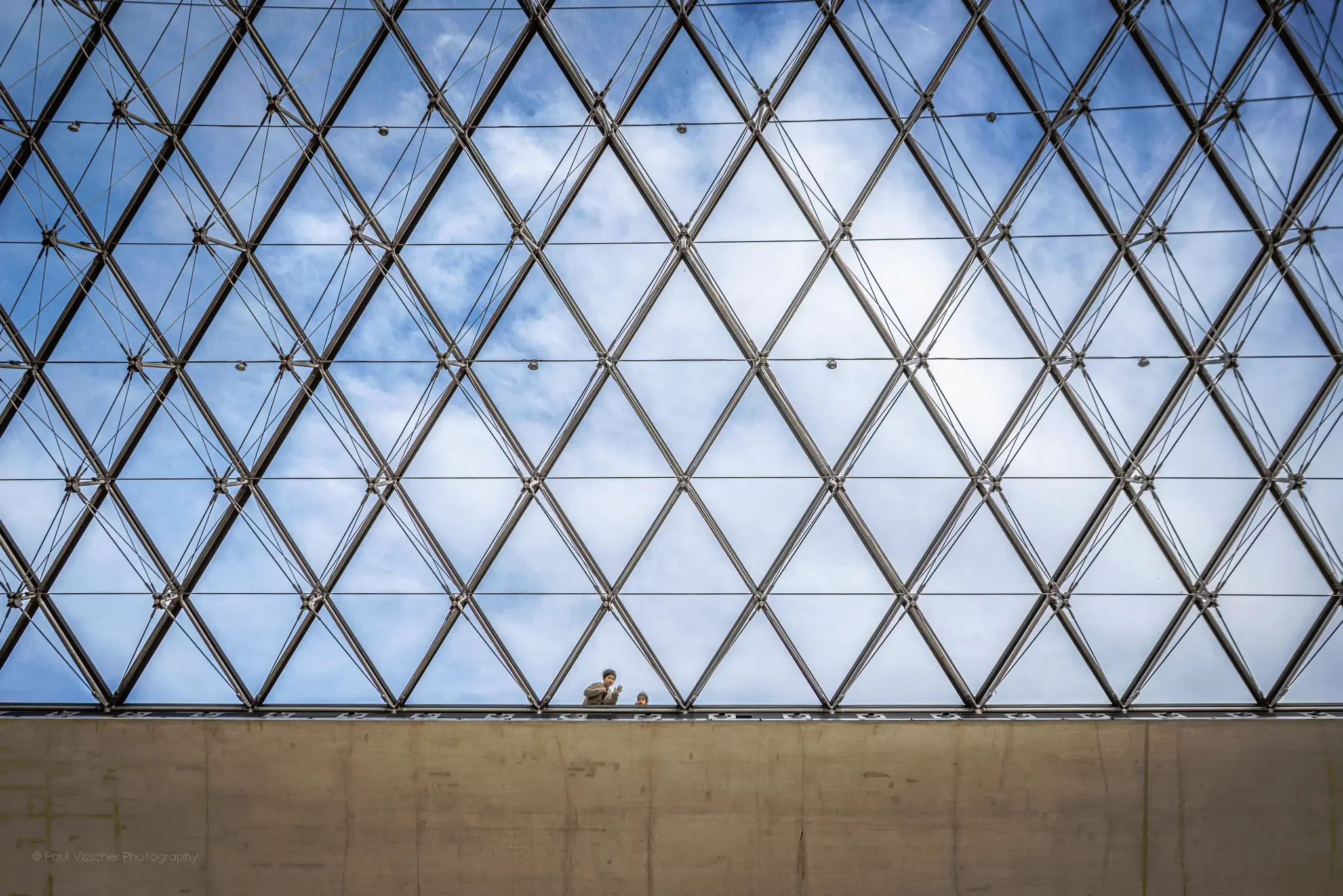 Inside the Louvre Pyramid – Light, Geometry, and Glass in Paris