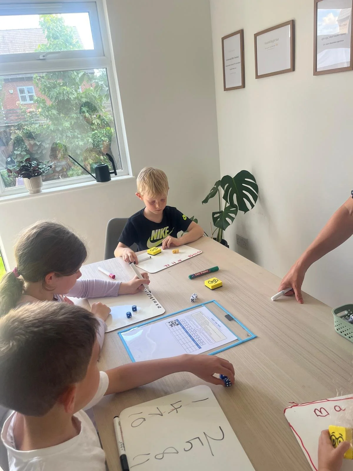 Children taking part in a small group primary maths tutoring session with qualified teacher Carrie Perrett in Ampthill.