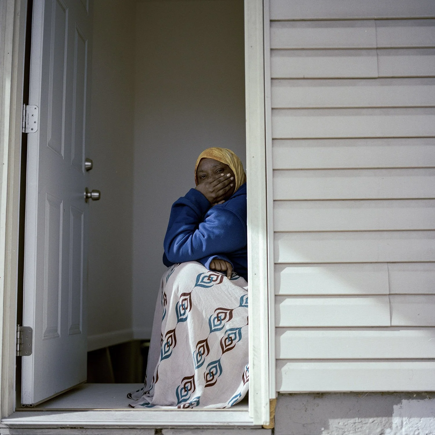 Khadija in their backyard, after spending the entire evening finishing the moving together. She said that her only dream is safety