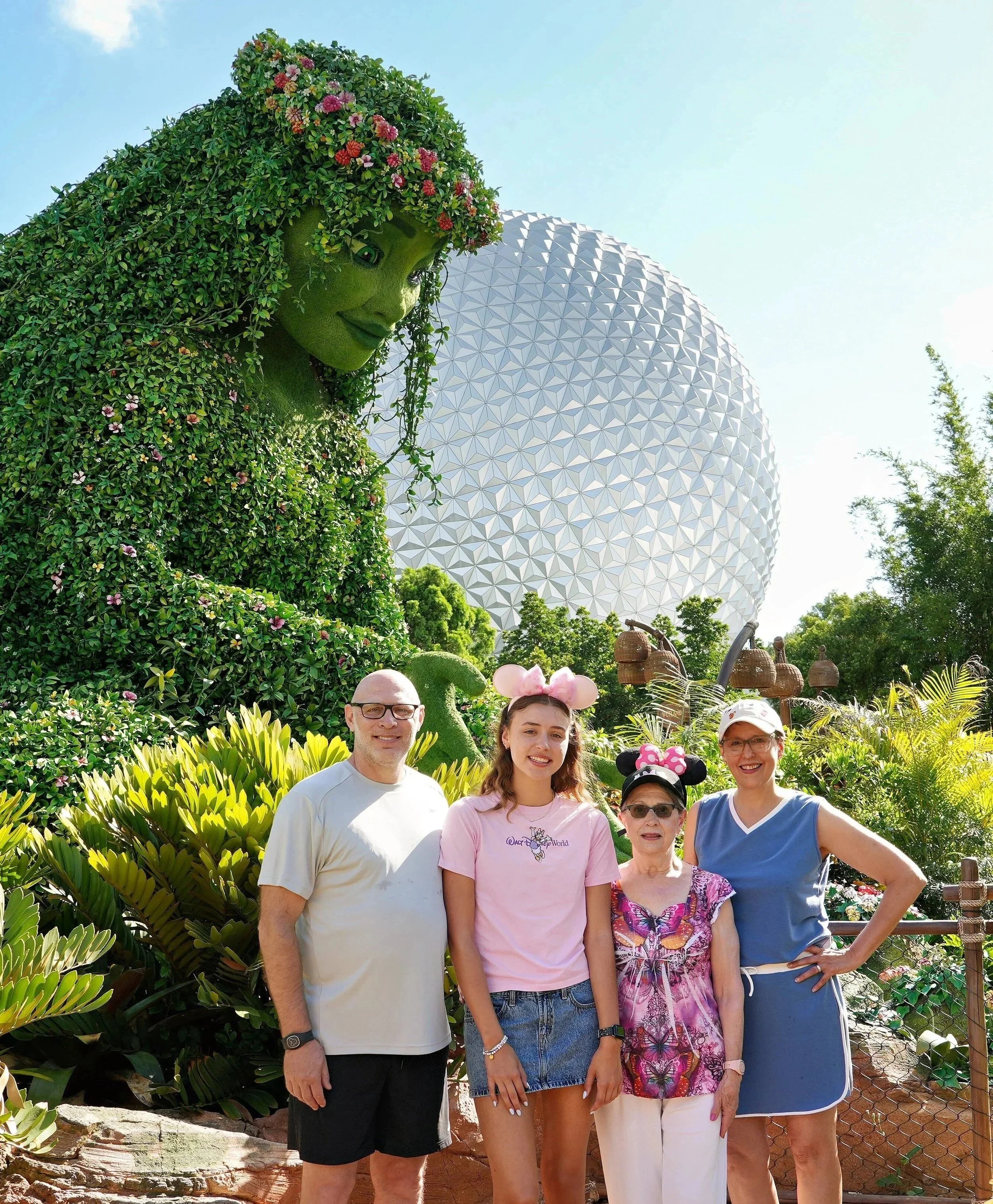 Topiary of Te Fiti from Disney's Moana in front of Spaceship Earth in  EPCOT. Topiary is part of the Journey of Water. 