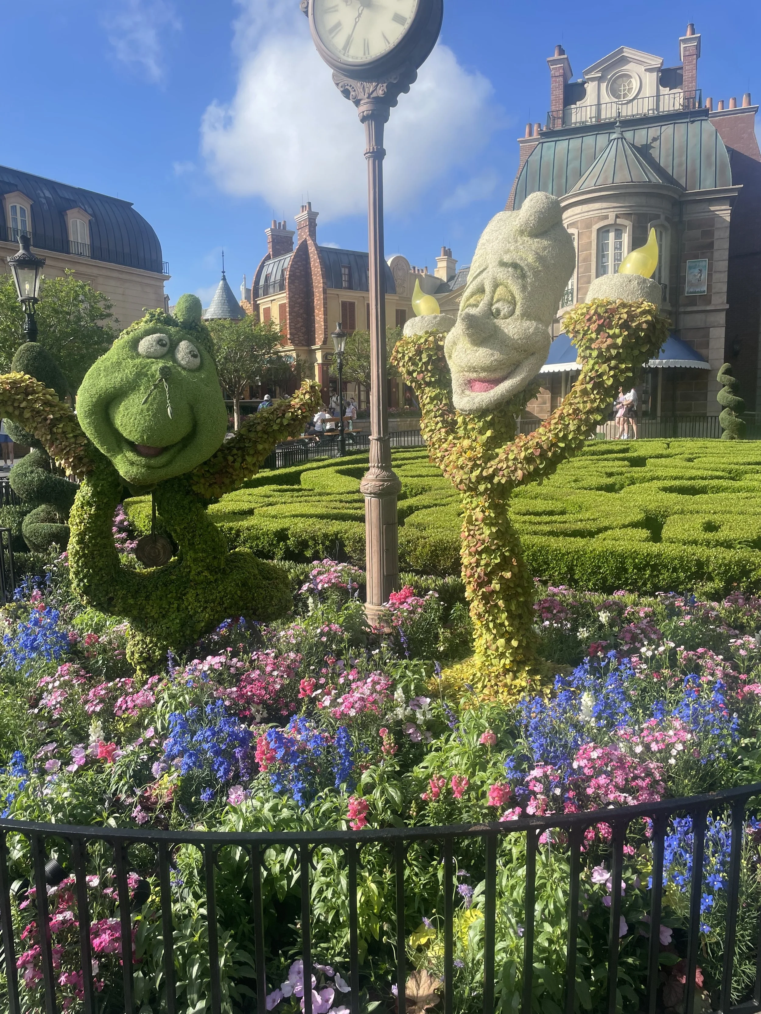 Topiaries of Codswoth and Lumiere in the France pavilion during the 2026 EPCOT's Flower and Garden Festival