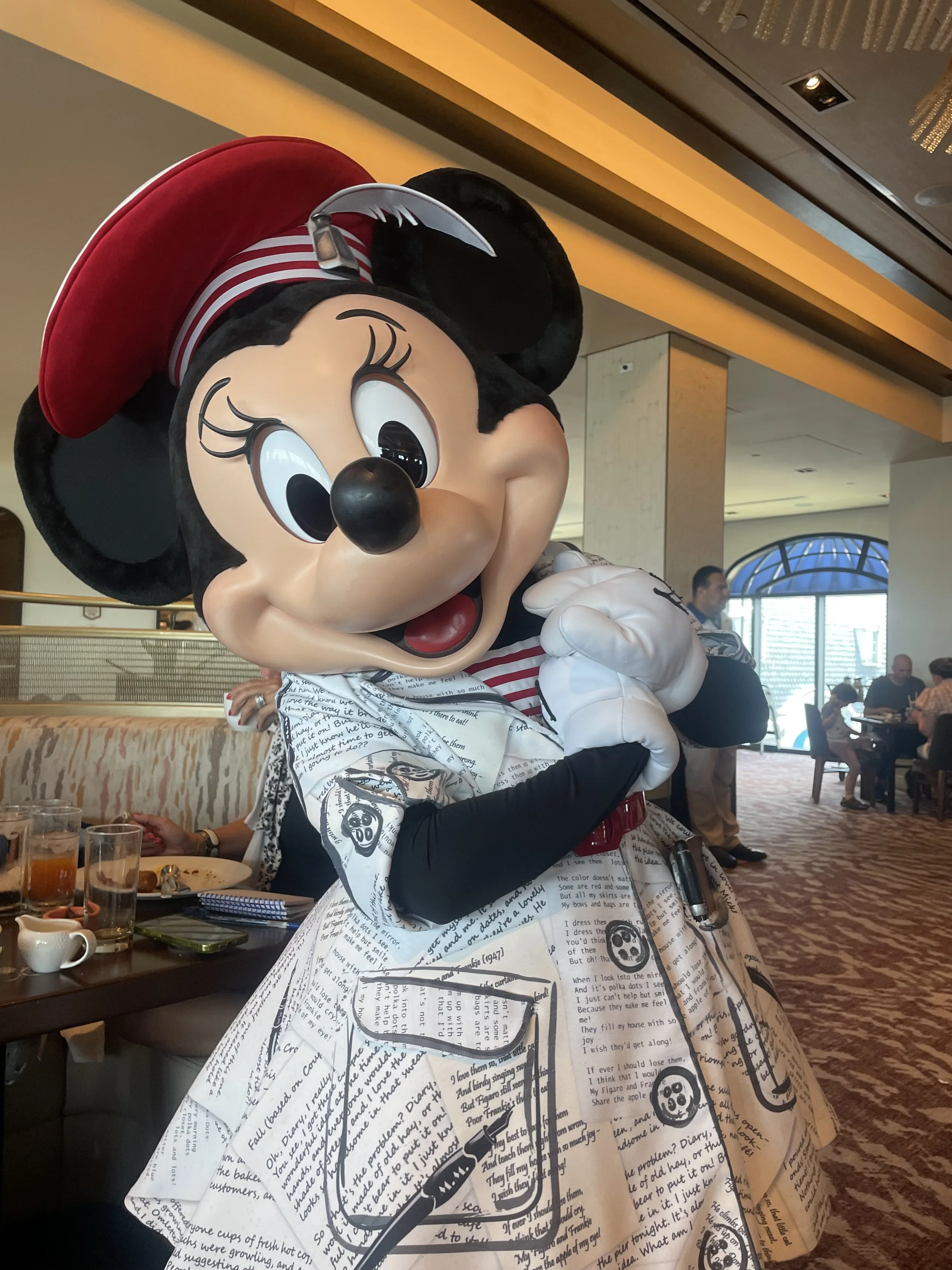 Minnie Mouse in her poet's dress at Topolino's Terrace Character Breakfast