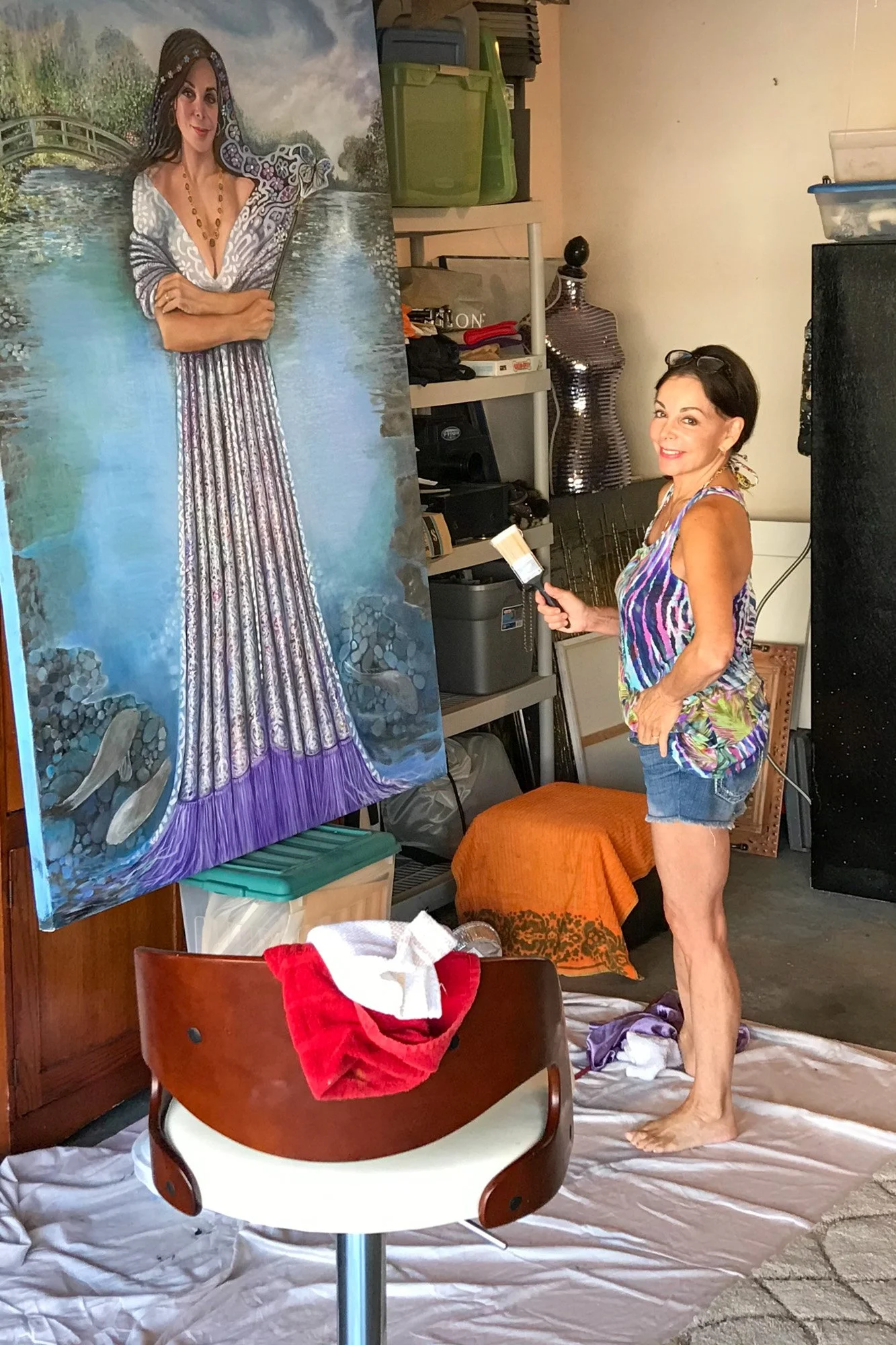 Fay Stassis Vernon painting a self-portrait inspired by Monet's gardens, in her Del Mar studio