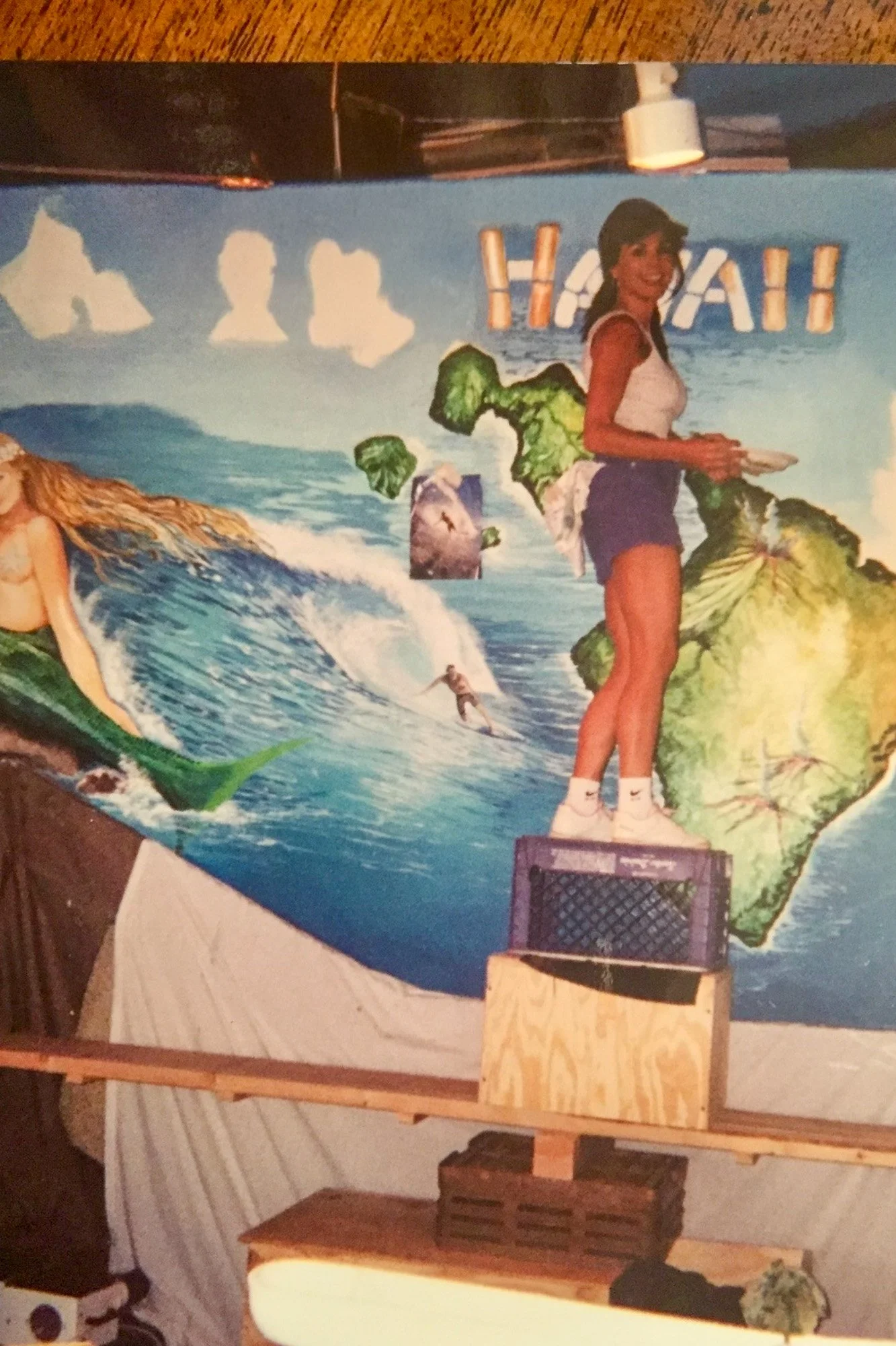 Fay Stassis Vernon in her forties, painting a mural at a job site