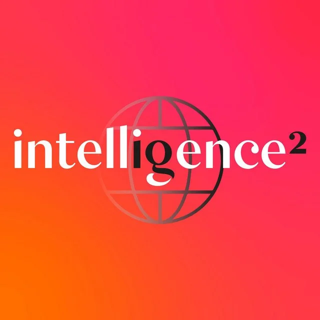 The word 'intelligence' with a stylized globe in the background on a pink and orange gradient background.