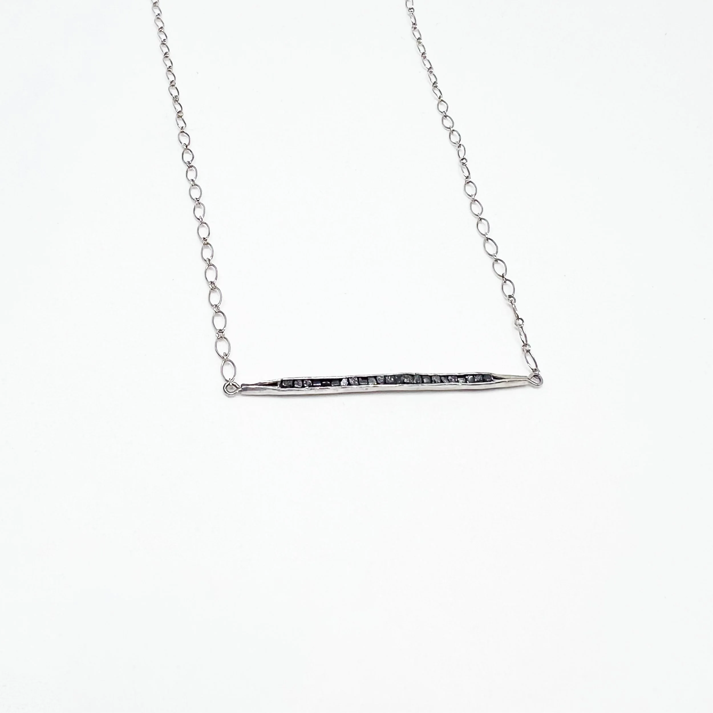Hand-Forged Anticlastic Pendant with Raw Black Diamonds