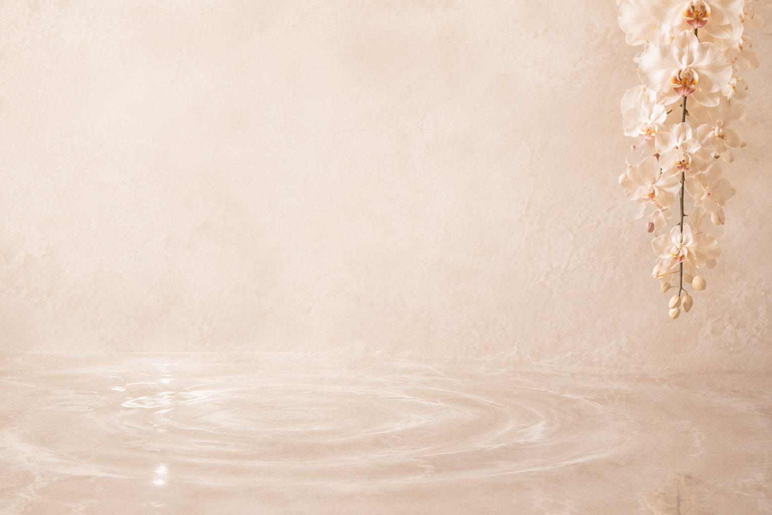 A beige marble wall with a waterfall and a cascading cream-colored orchid flower on the right side.