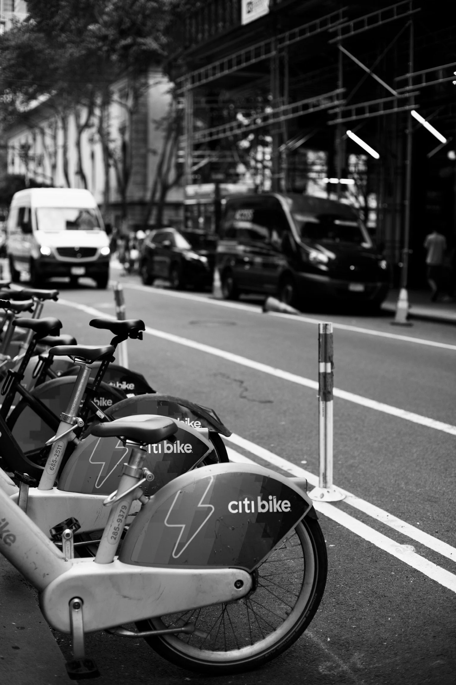 a black and white image of a New York street