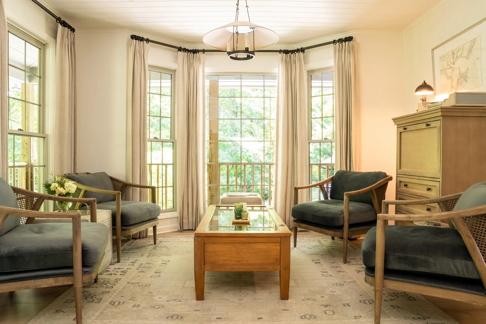 Mountain lounge in Highlands NC with bay window seating and linen drapery