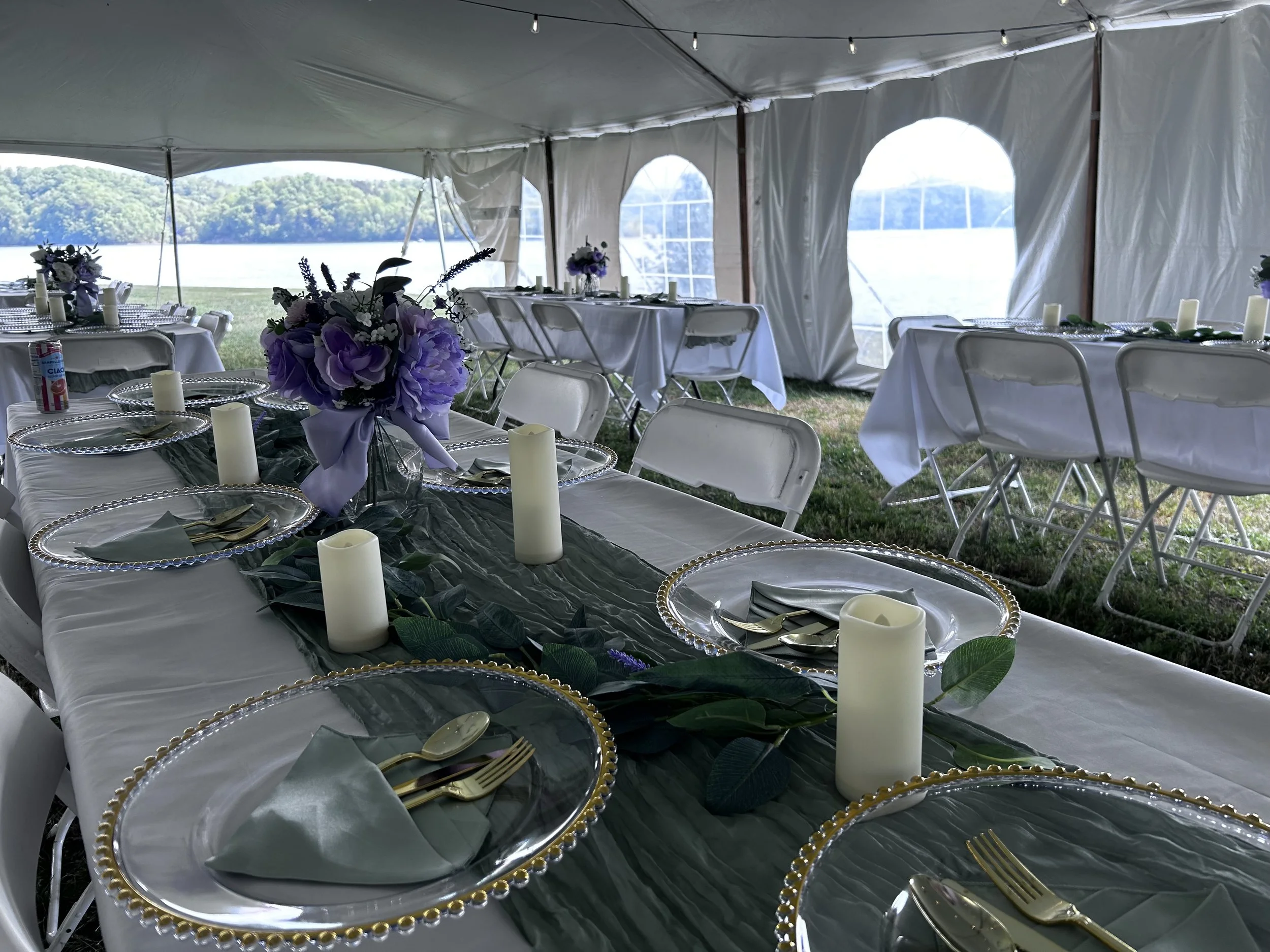 Outdoor tent wedding reception with lake view, lavender centerpieces, coordinated by Well Gathered