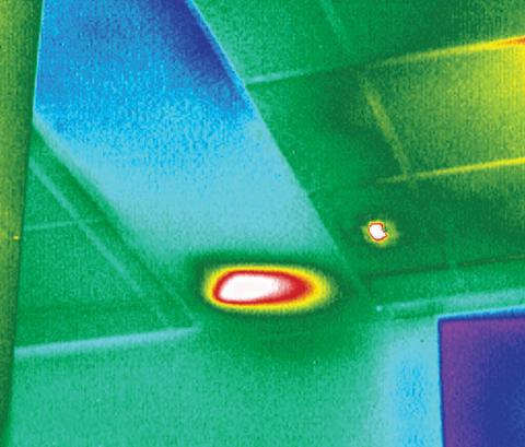 Infrared thermal image of a ceiling with a heat source.