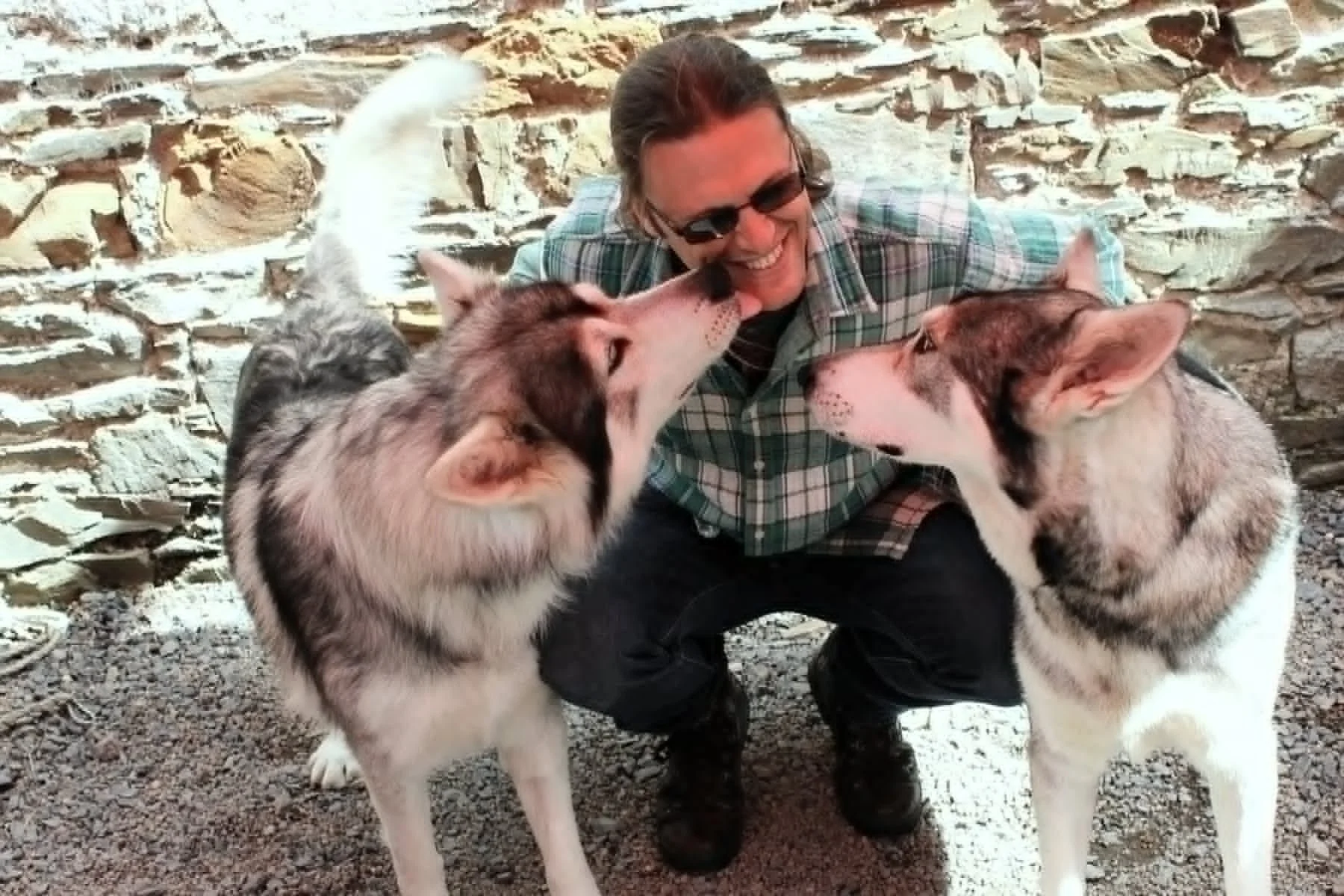 photo of Dr. Smith in Northern Ireland with Odin and Thorn, two canine actors who stared in Game of Thrones