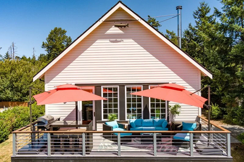 Private upper deck with lounge seating, BBQ, and open-sky views.