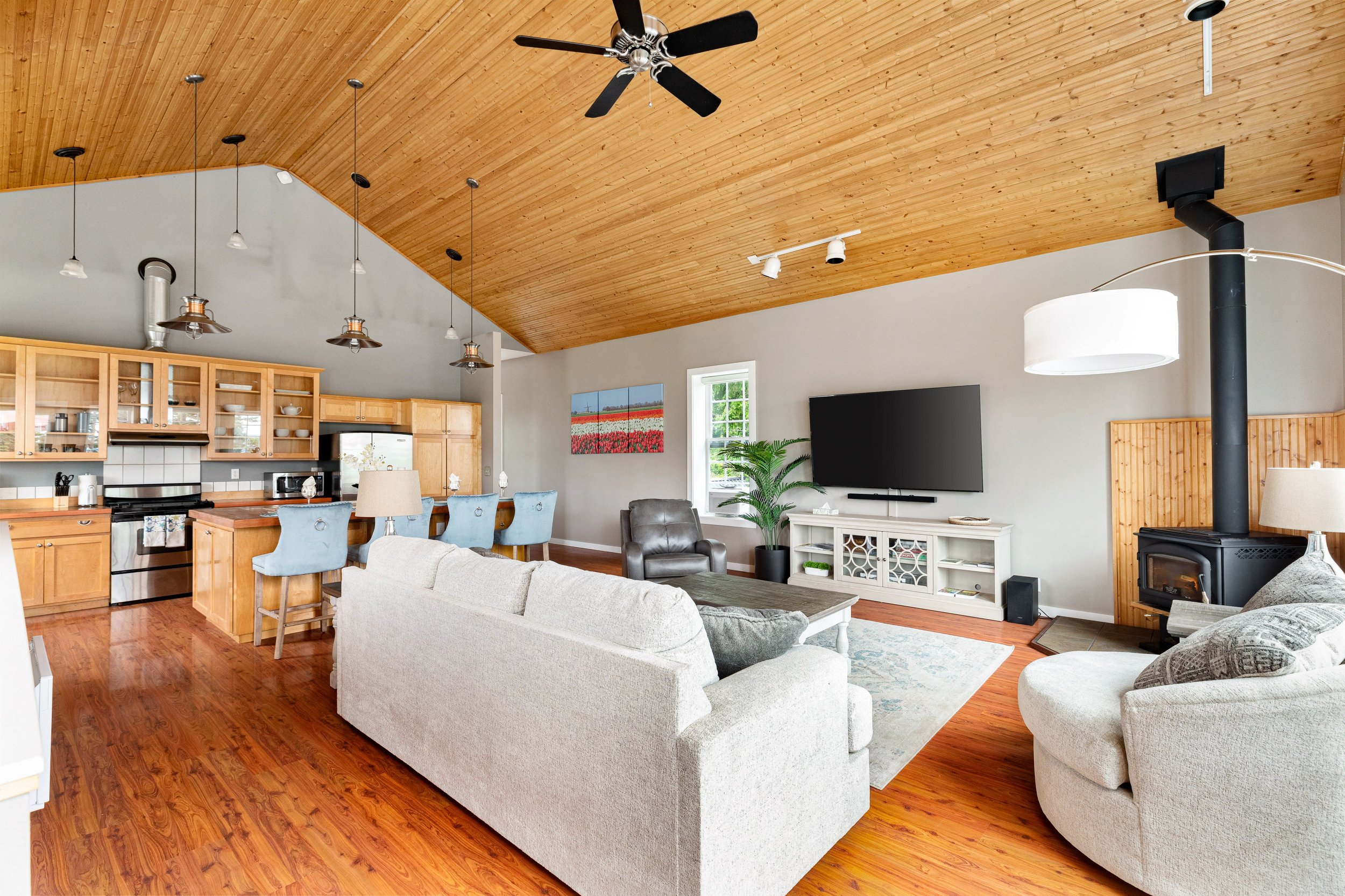 
Soaring cedar ceilings, wood-burning stove, open-plan living.