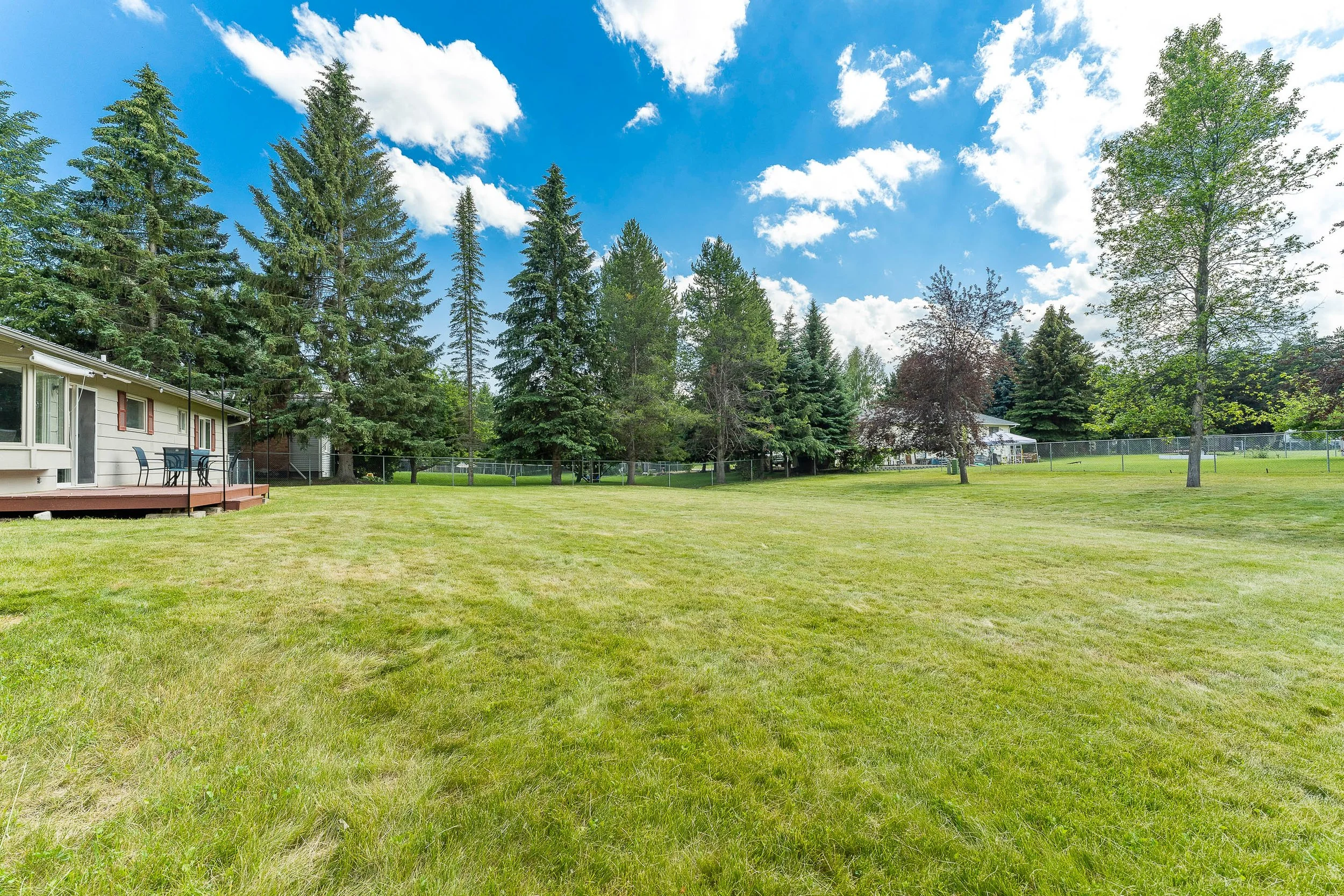 Enormous fully fenced backyard with open Montana sky and room to roam