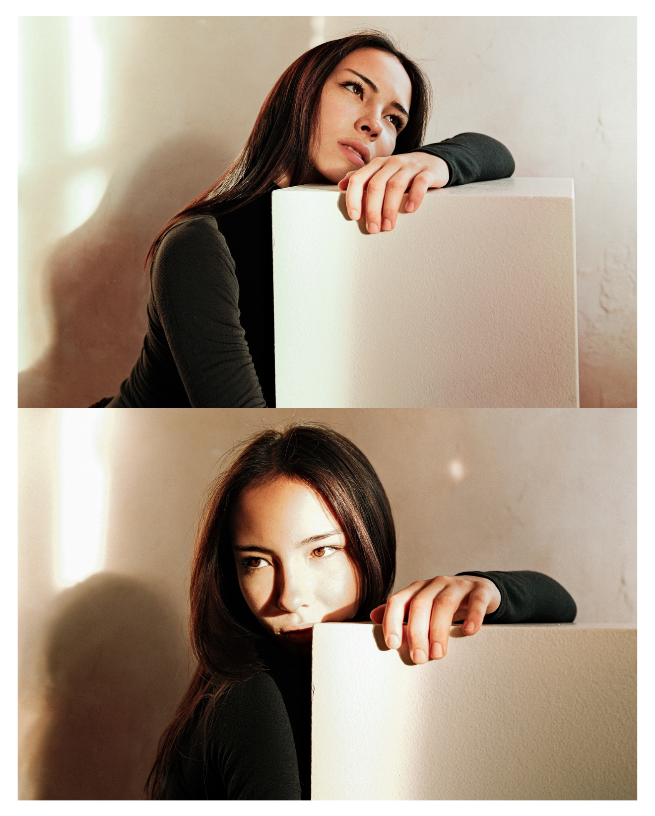 A woman with long dark hair and a black top is resting her head and arm on a white rectangular block. She appears thoughtful, gazing off to the side. The background is a neutral beige wall with soft lighting.